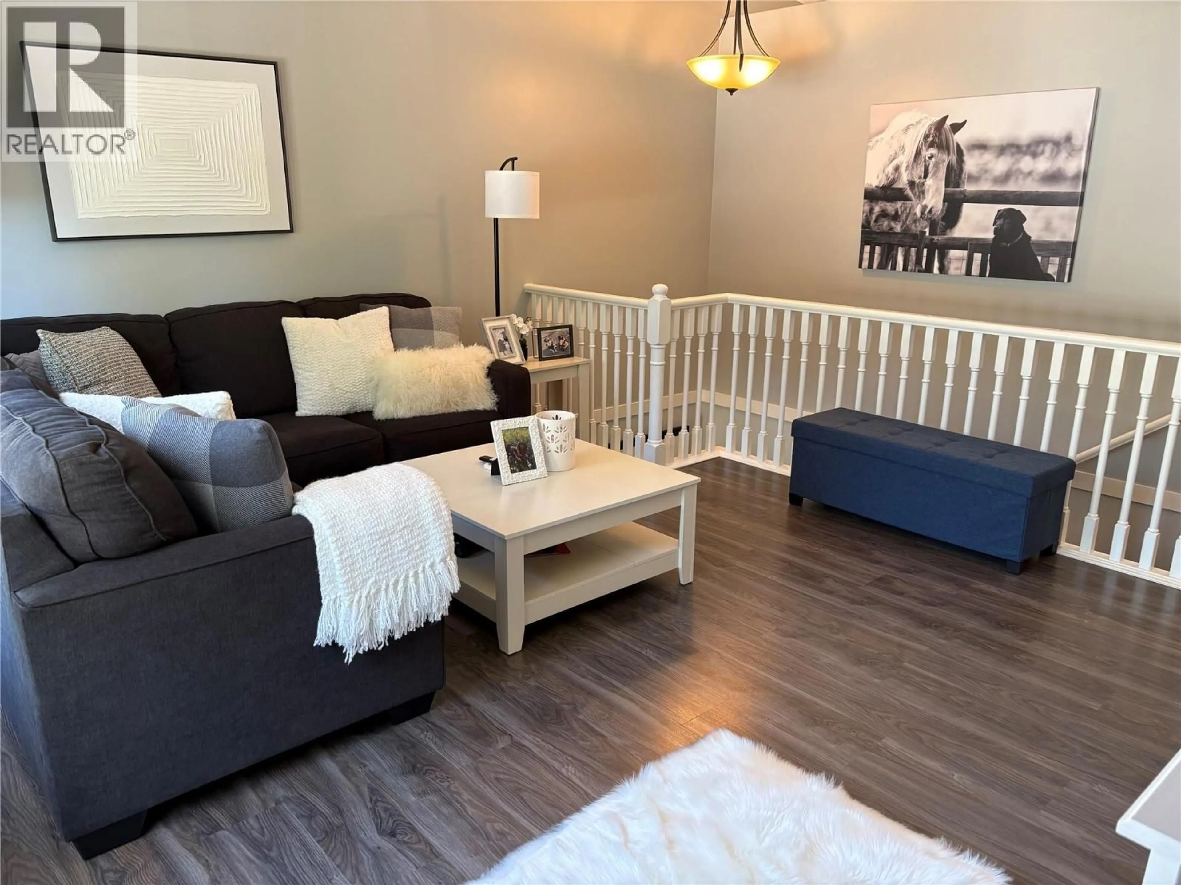 Living room with furniture, wood/laminate floor for 111 - 1801 53 AVENUE, Vernon British Columbia V1T4E7