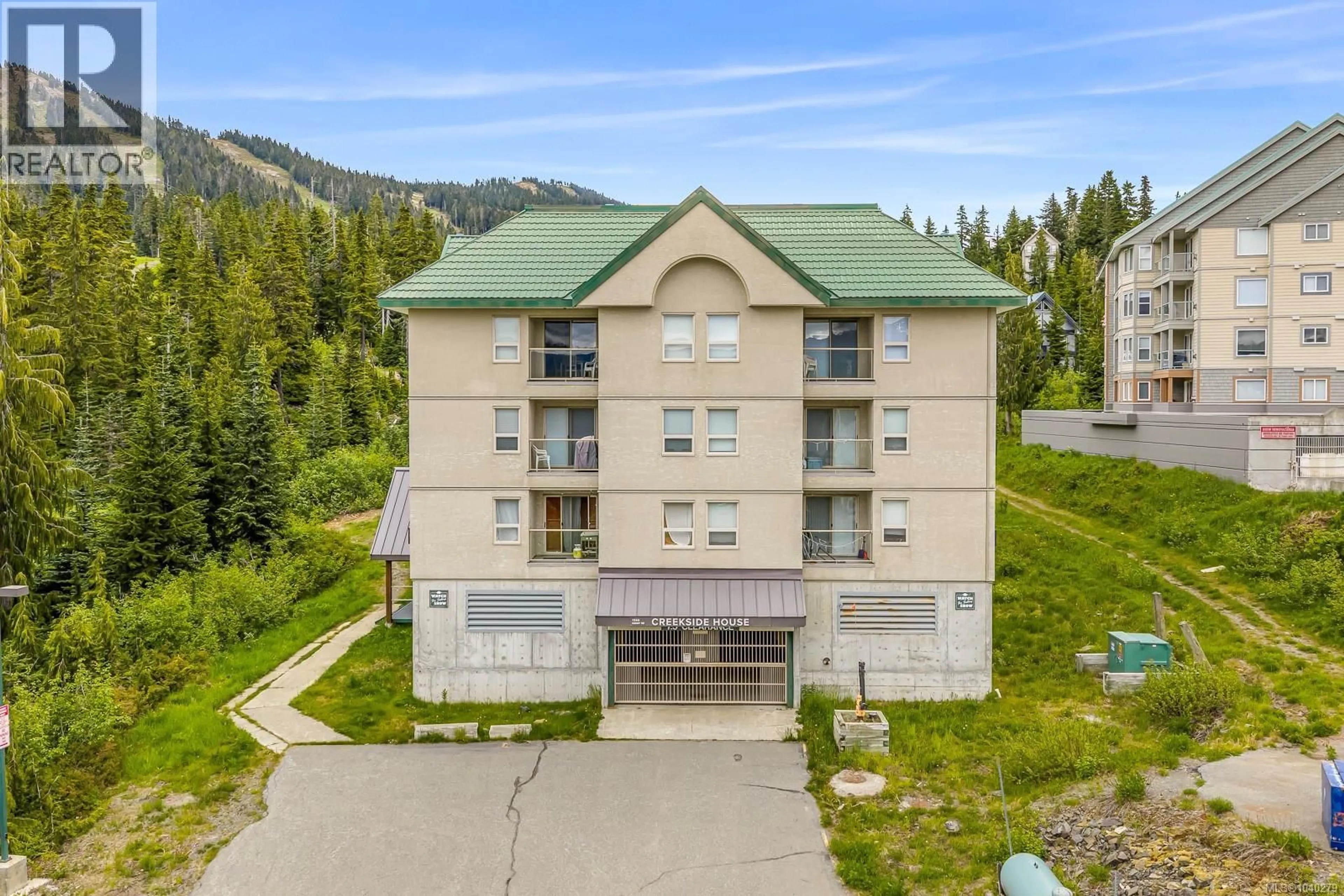 A pic from outside/outdoor area/front of a property/back of a property/a pic from drone, mountain view for 301 - 1380 HENRY ROAD, Courtenay British Columbia V9J1L0