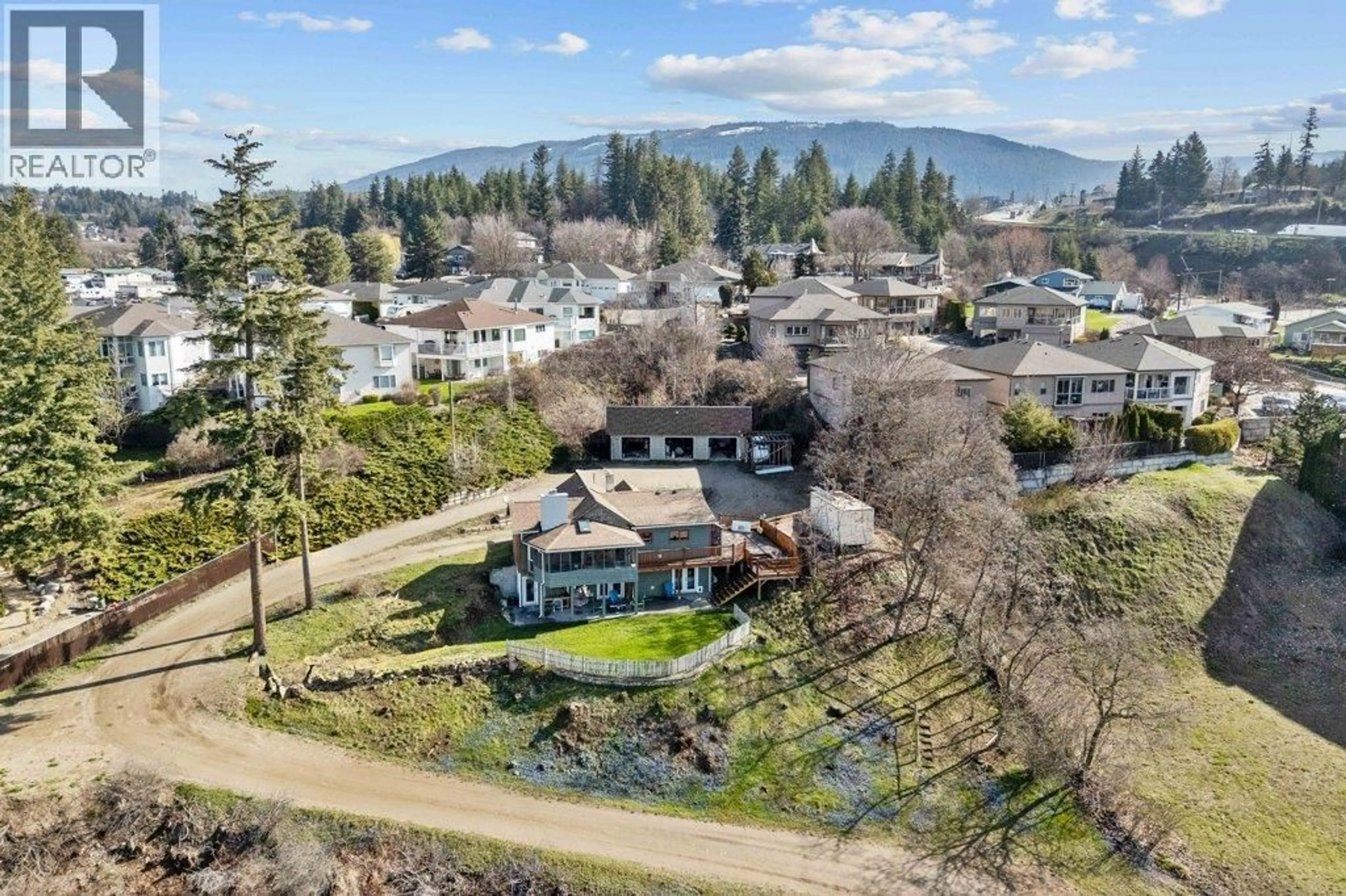 A pic from outside/outdoor area/front of a property/back of a property/a pic from drone, mountain view for 1321 10TH AVENUE, Salmon Arm British Columbia V1E2V6