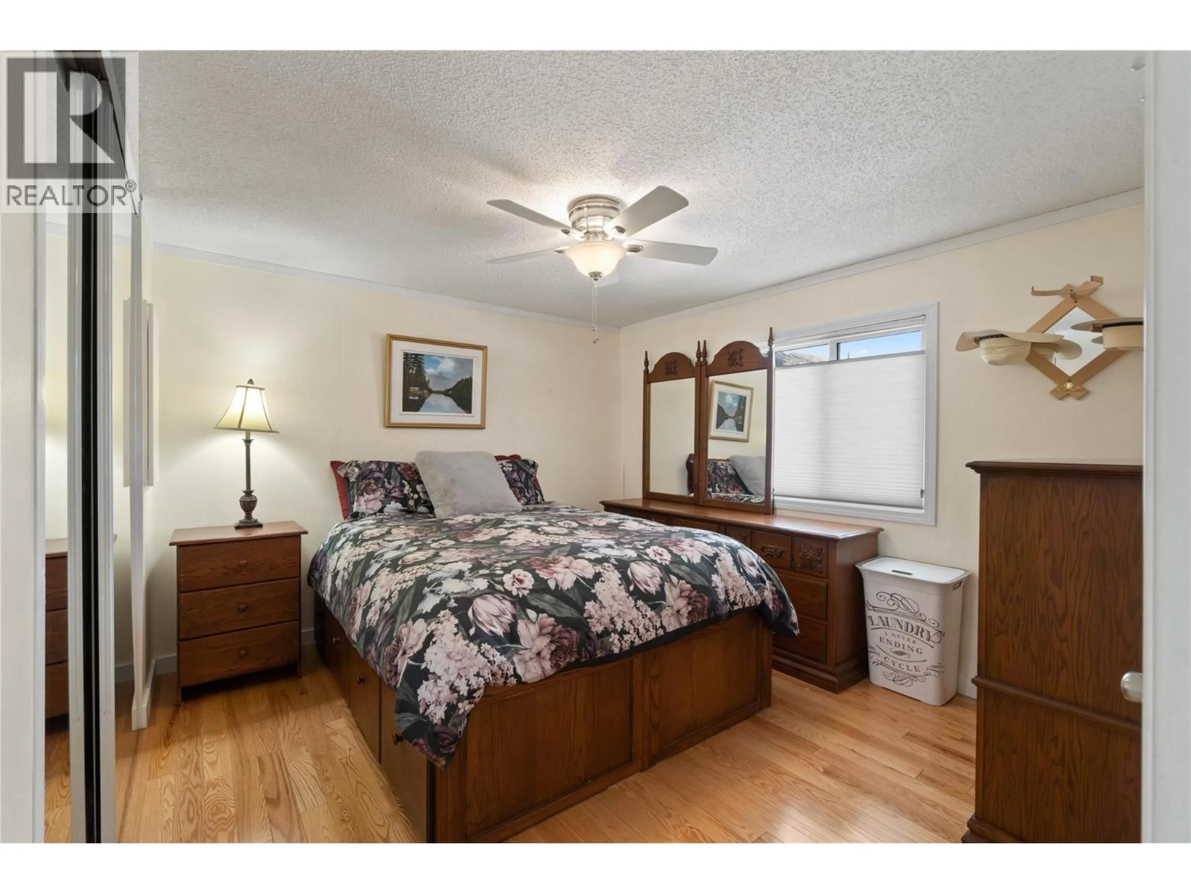 Bedroom with bed, wood/laminate floor for 54 - 7545 DALLAS DRIVE, Kamloops British Columbia V2C6X8