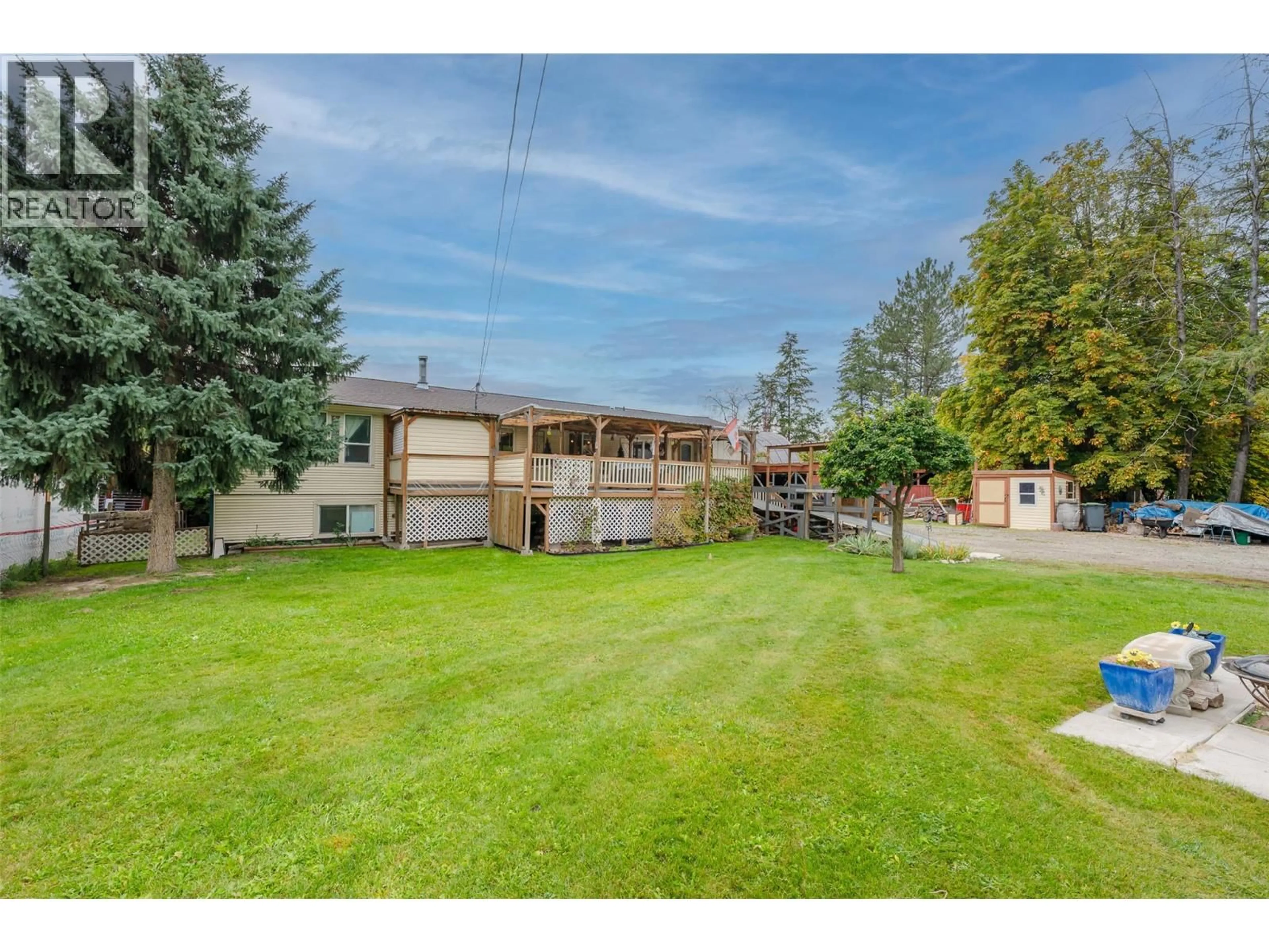 A pic from outside/outdoor area/front of a property/back of a property/a pic from drone, street for 5467 SAWMILL ROAD, Oliver British Columbia V0H1T9
