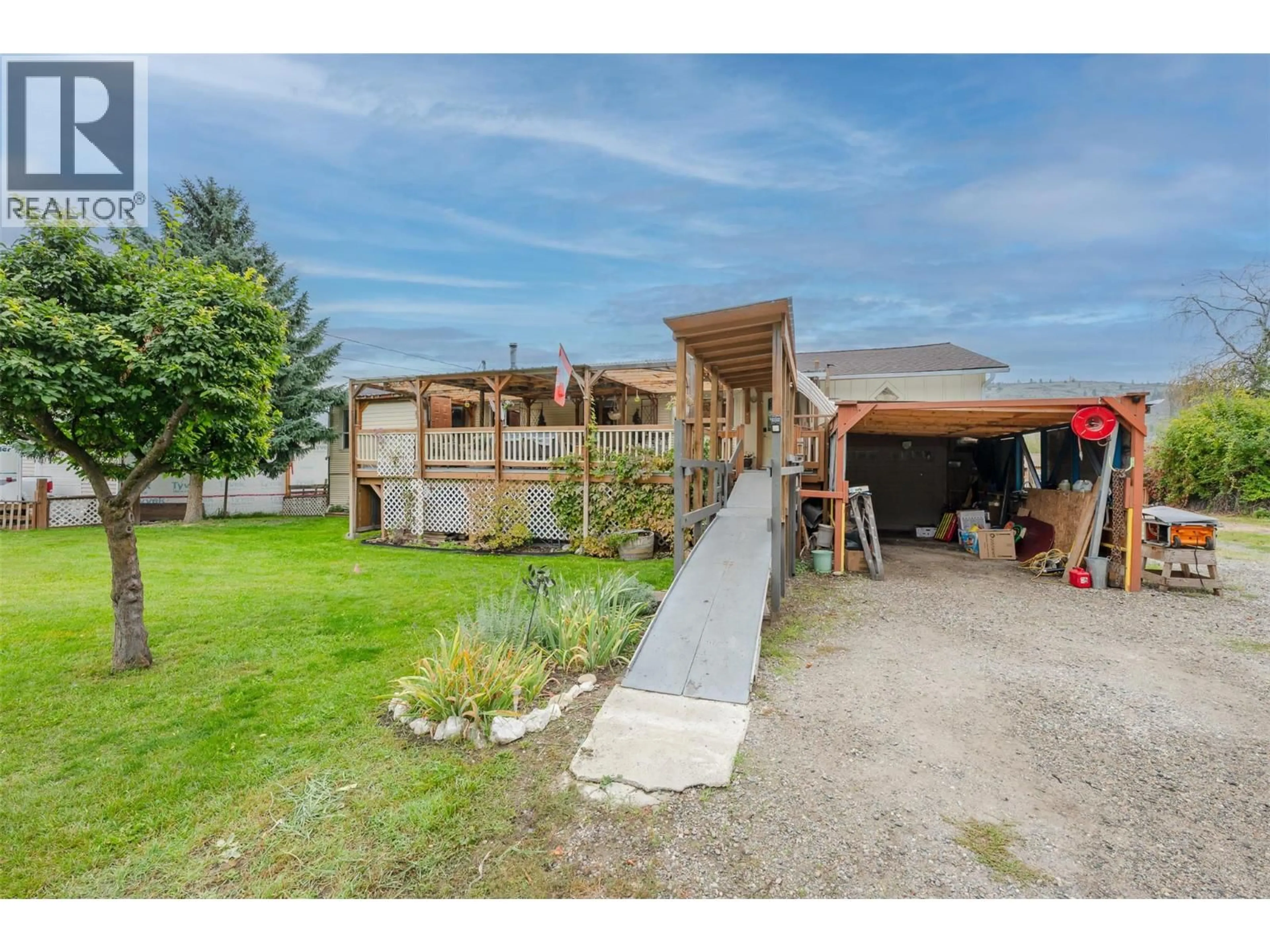 A pic from outside/outdoor area/front of a property/back of a property/a pic from drone, street for 5467 SAWMILL ROAD, Oliver British Columbia V0H1T9