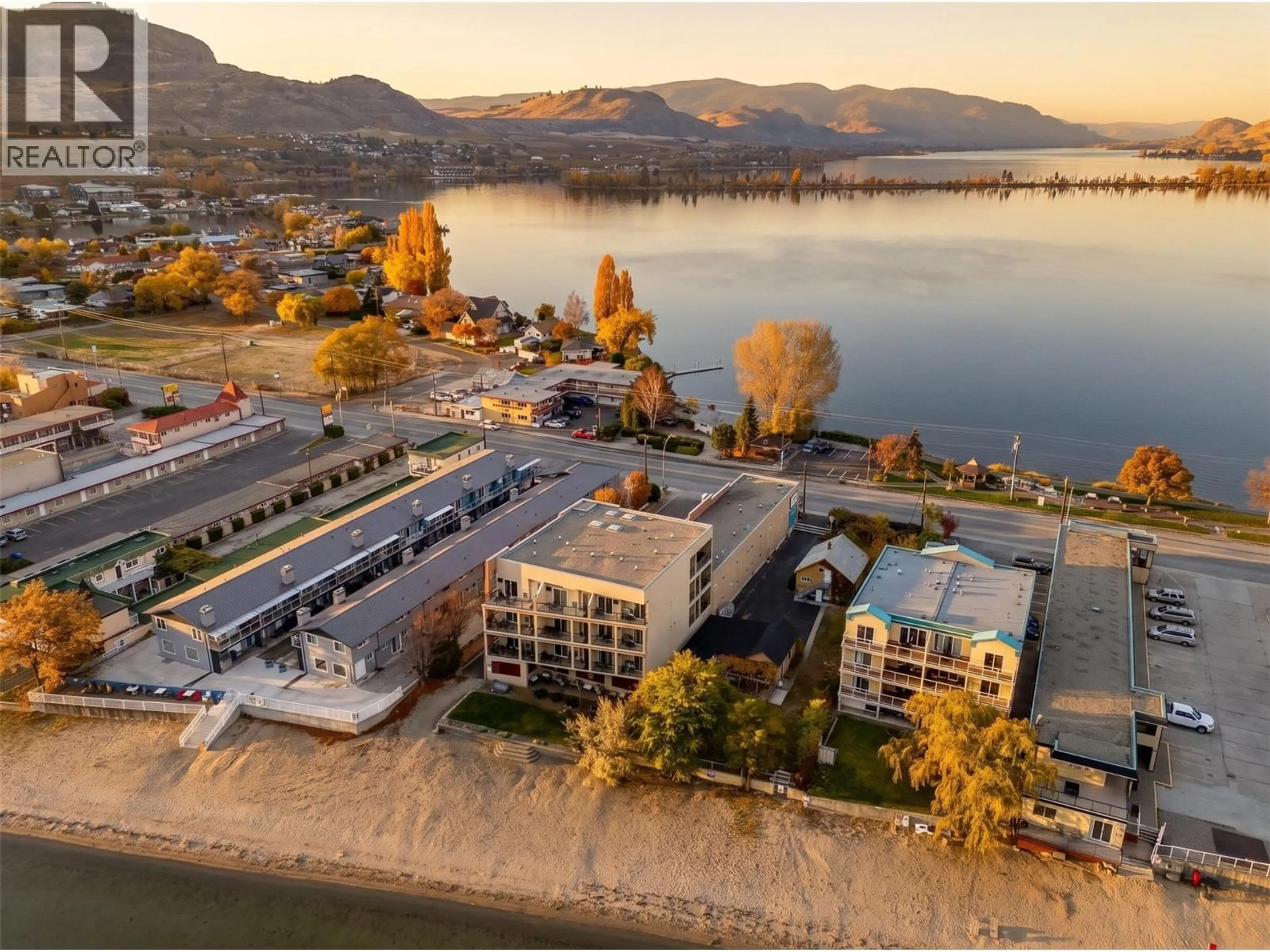 A pic from outside/outdoor area/front of a property/back of a property/a pic from drone, water/lake/river/ocean view for 207 - 7310 MAIN STREET, Osoyoos British Columbia V0H1V0