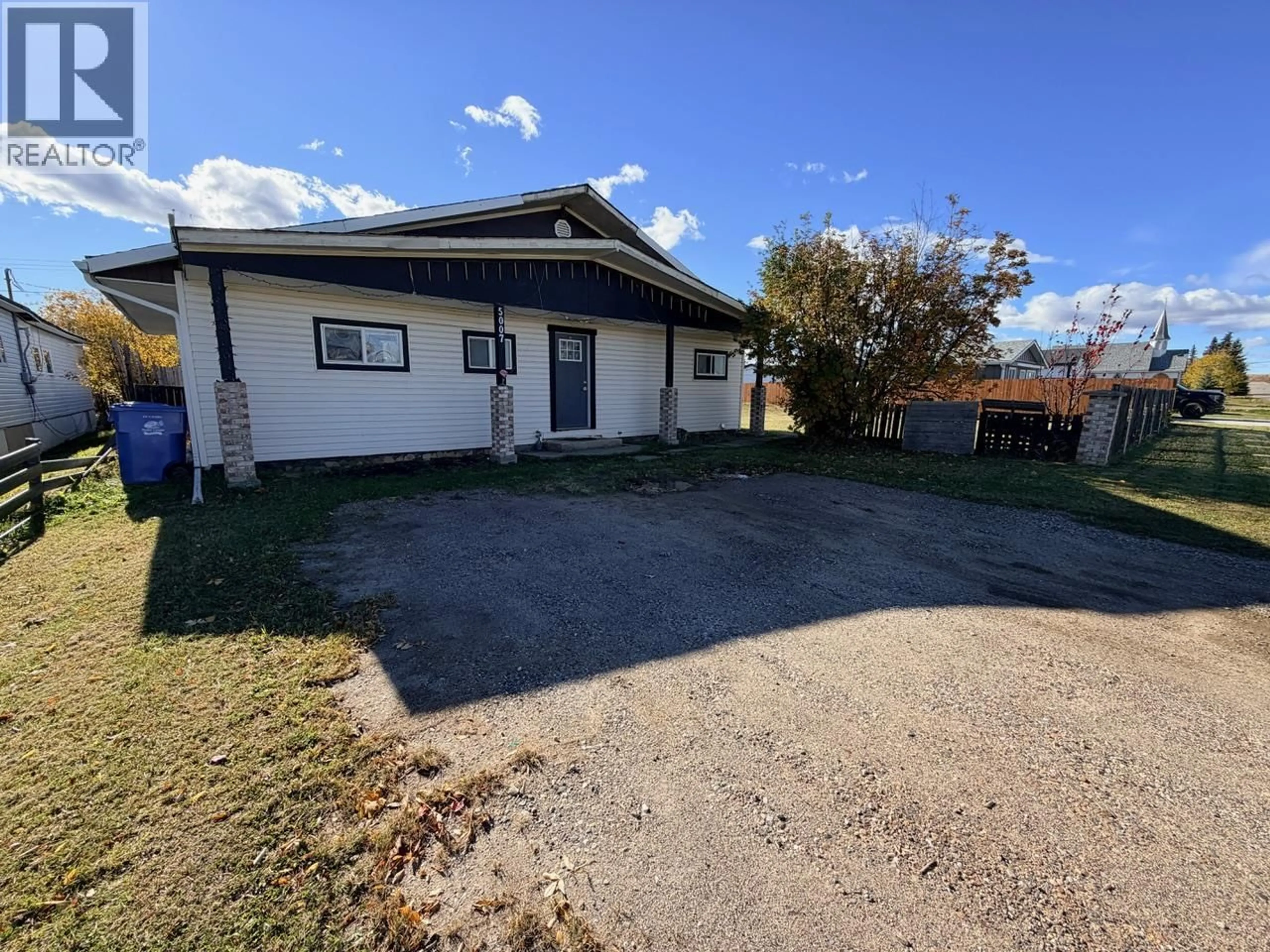 A pic from outside/outdoor area/front of a property/back of a property/a pic from drone, building for 5007 48 AVENUE, Pouce Coupe British Columbia V0C2C0