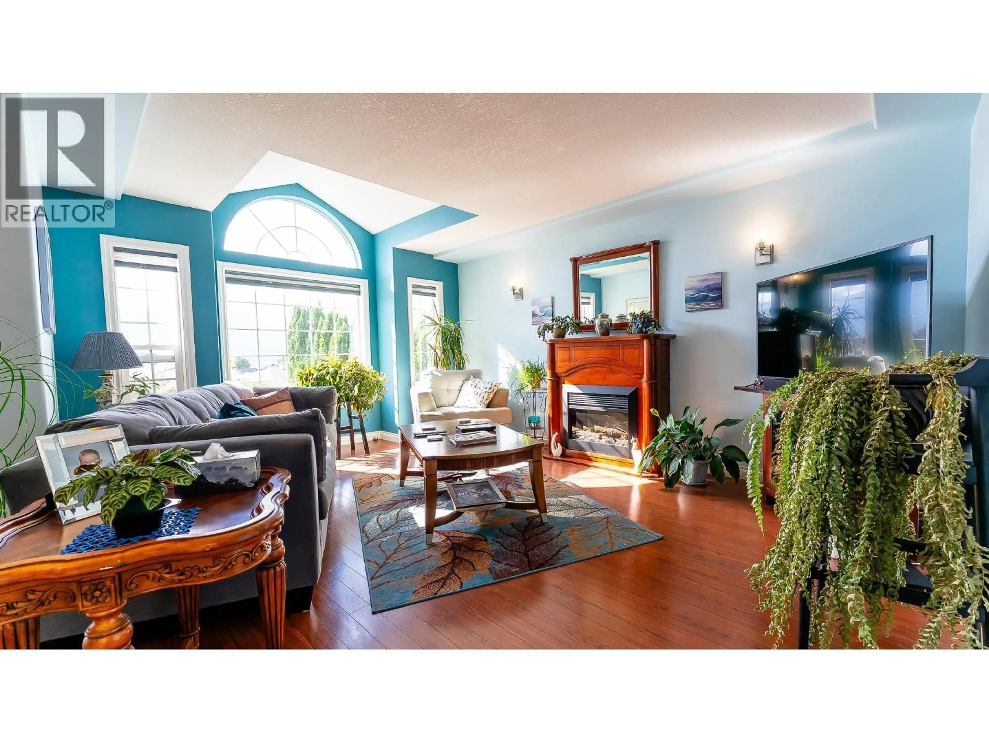 Living room with furniture, wood/laminate floor for 1291 49 AVENUE NORTHEAST, Salmon Arm British Columbia V1E3P1