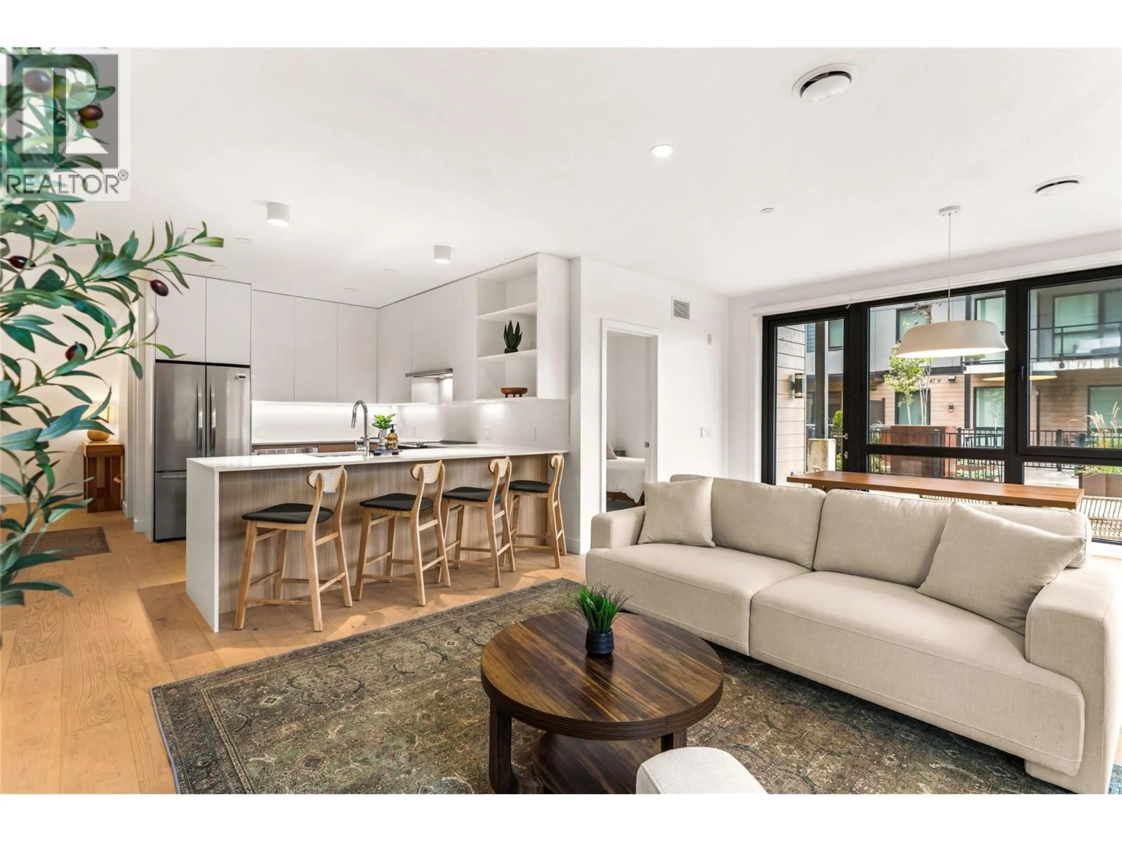 Open concept kitchen, wood/laminate floor for 2101 - 1702 COURSIER AVENUE, Revelstoke British Columbia V0E2S1