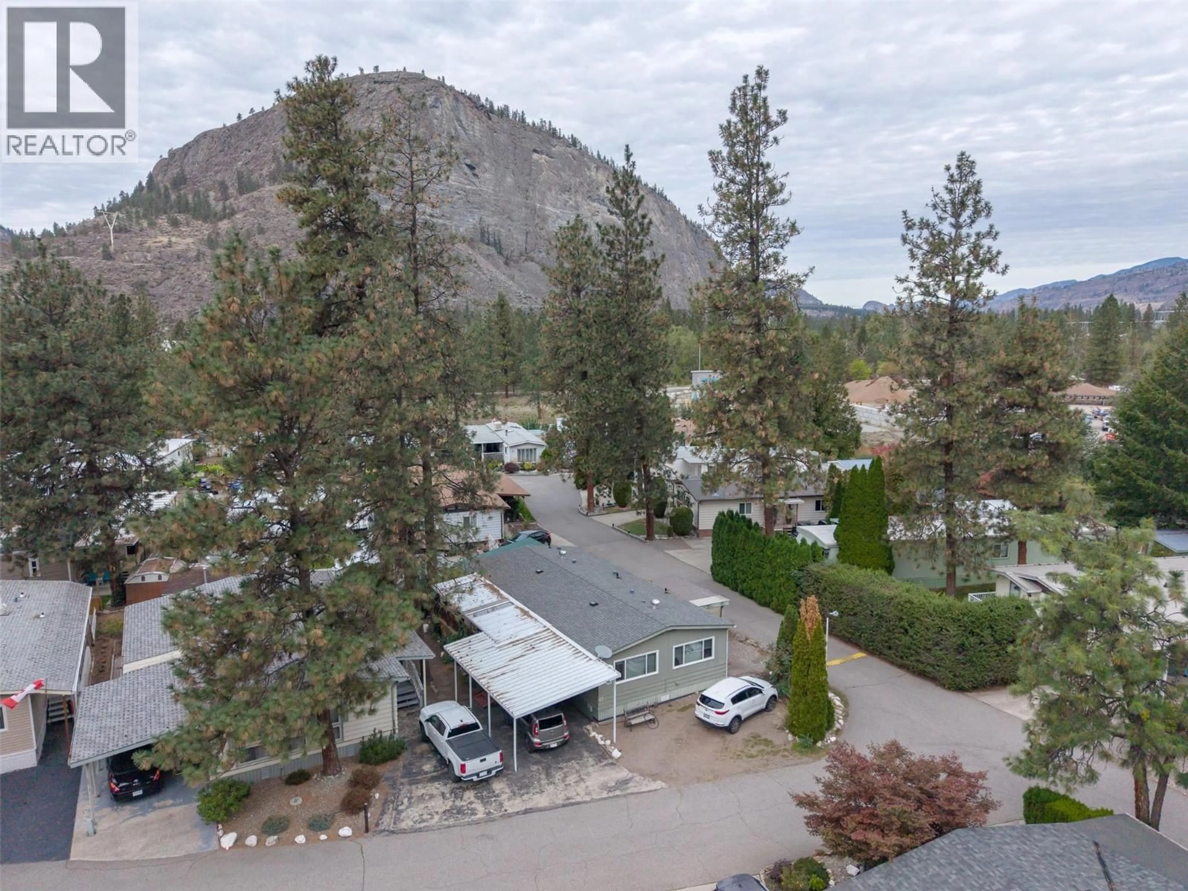 A pic from outside/outdoor area/front of a property/back of a property/a pic from drone, mountain view for 67 - 8487 HIGHWAY 97 HIGHWAY, Oliver British Columbia V0H1T2