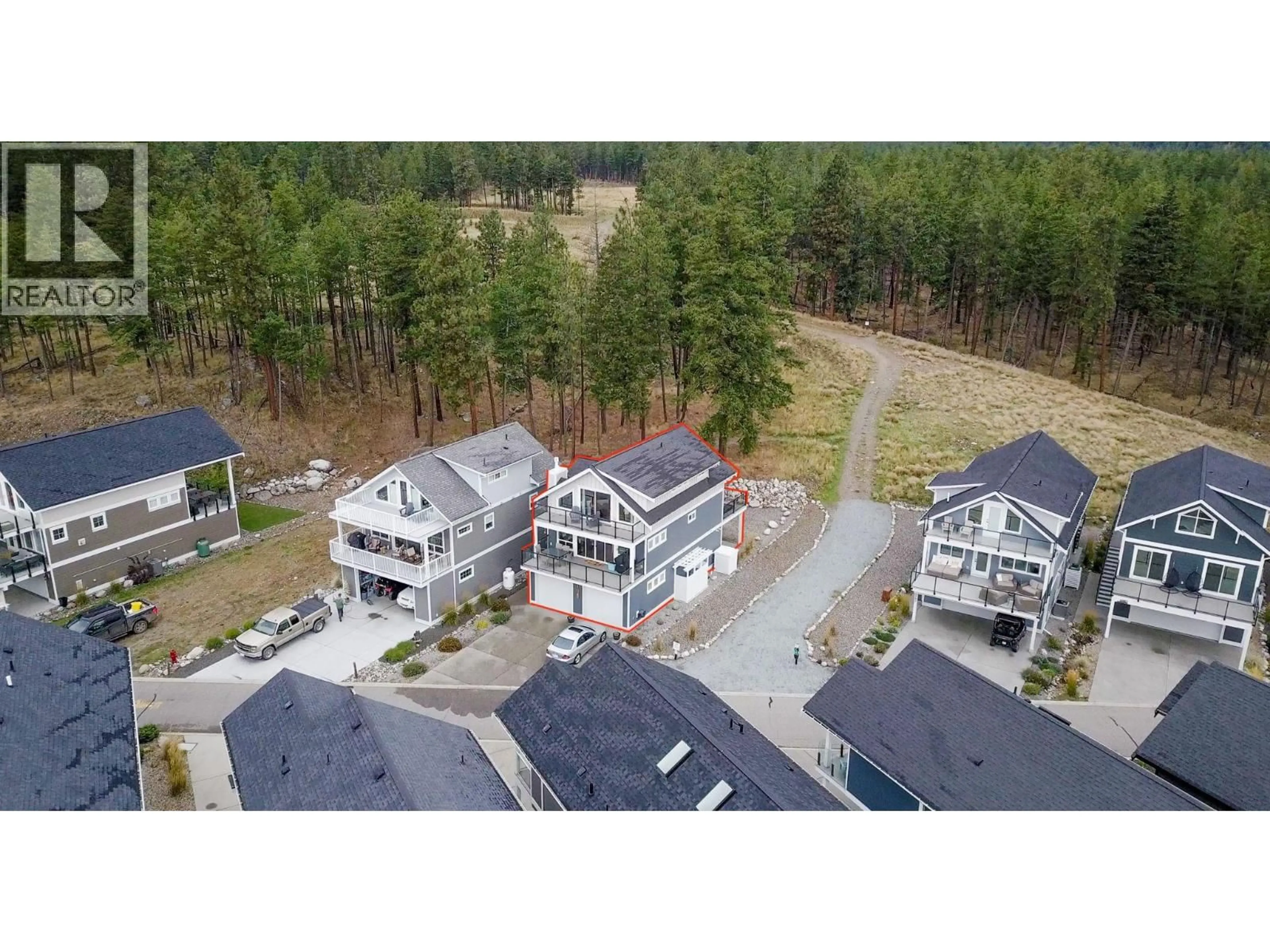 A pic from outside/outdoor area/front of a property/back of a property/a pic from drone, mountain view for 6976 TERAZONA DRIVE, Kelowna British Columbia V1Z3R8