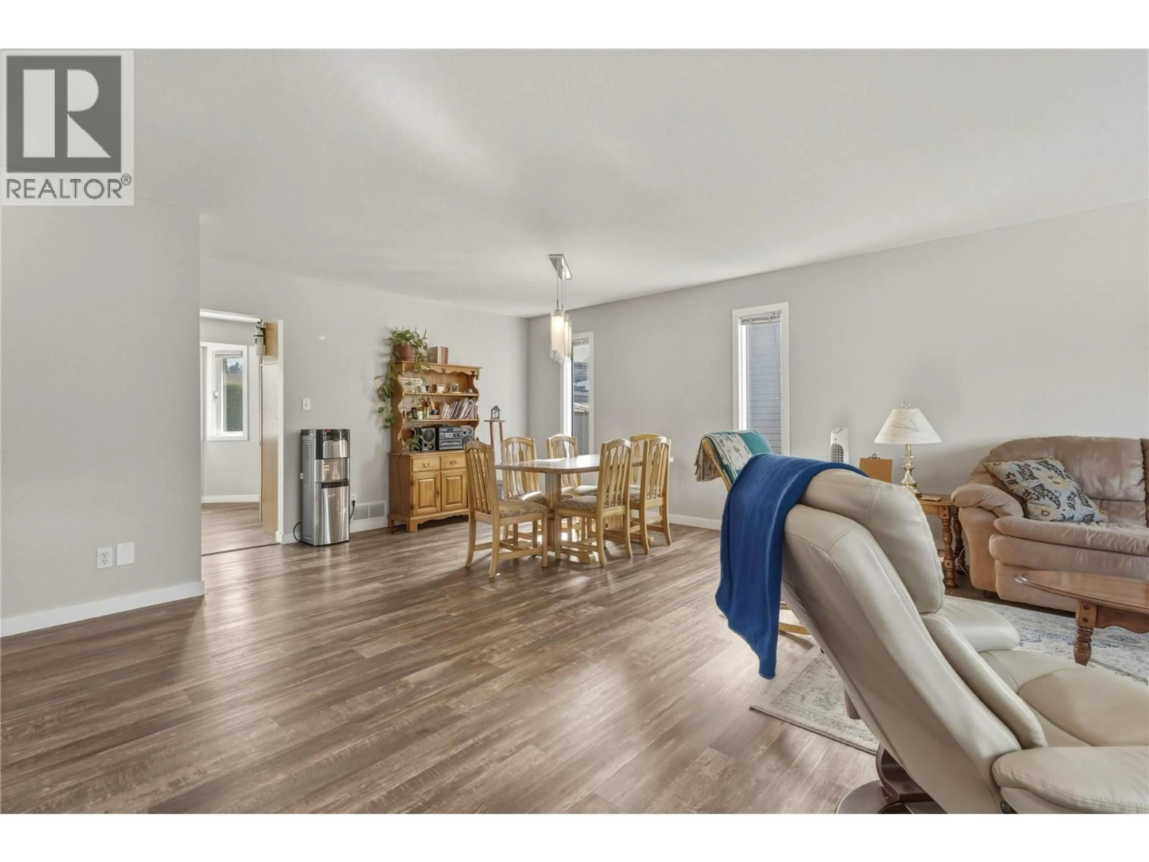 Living room with furniture, wood/laminate floor for 317 3RD STREET, Vernon British Columbia V1H1Z1