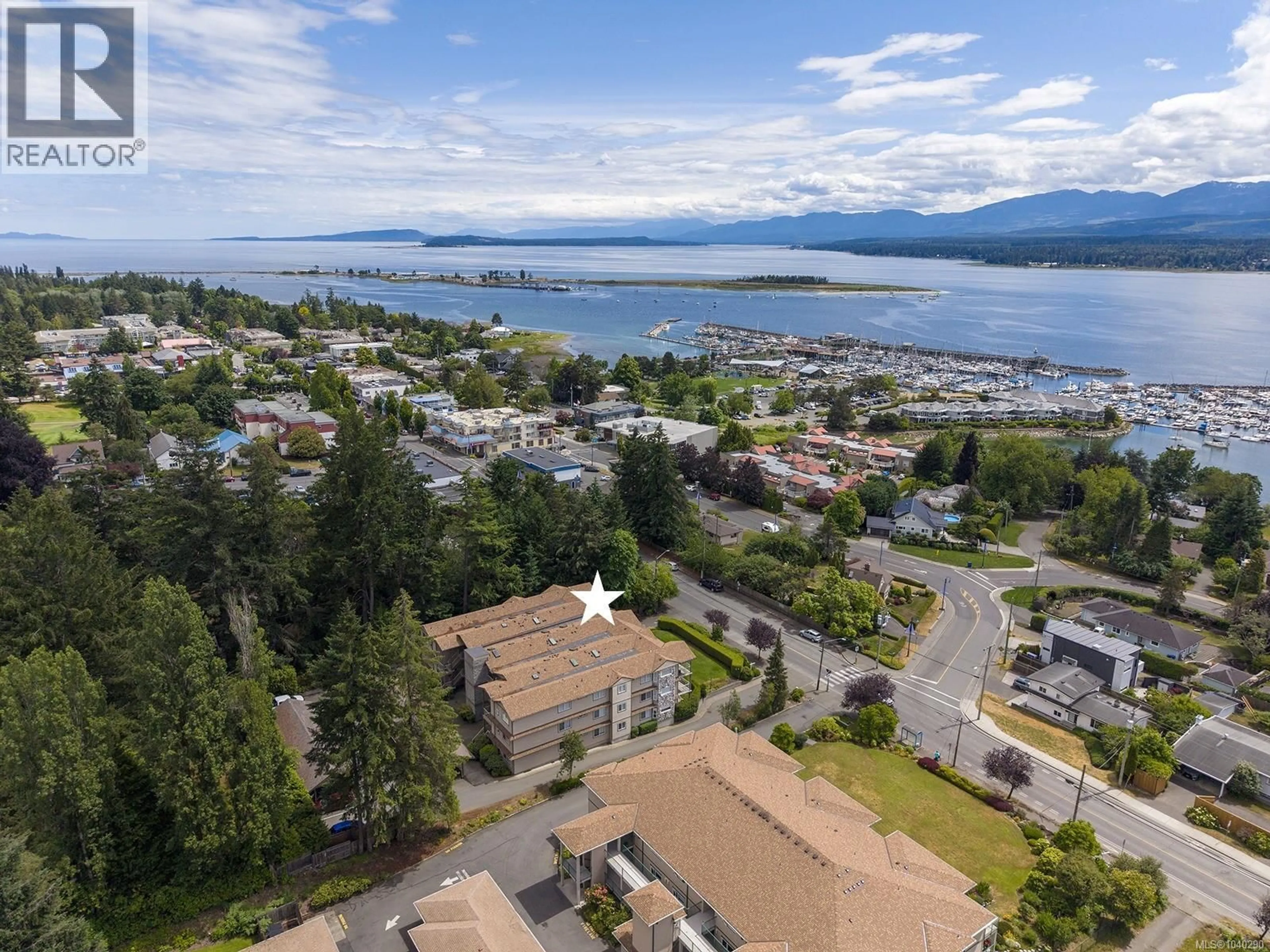A pic from outside/outdoor area/front of a property/back of a property/a pic from drone, water/lake/river/ocean view for 304 - 1860 COMOX AVENUE, Comox British Columbia V9M3M7