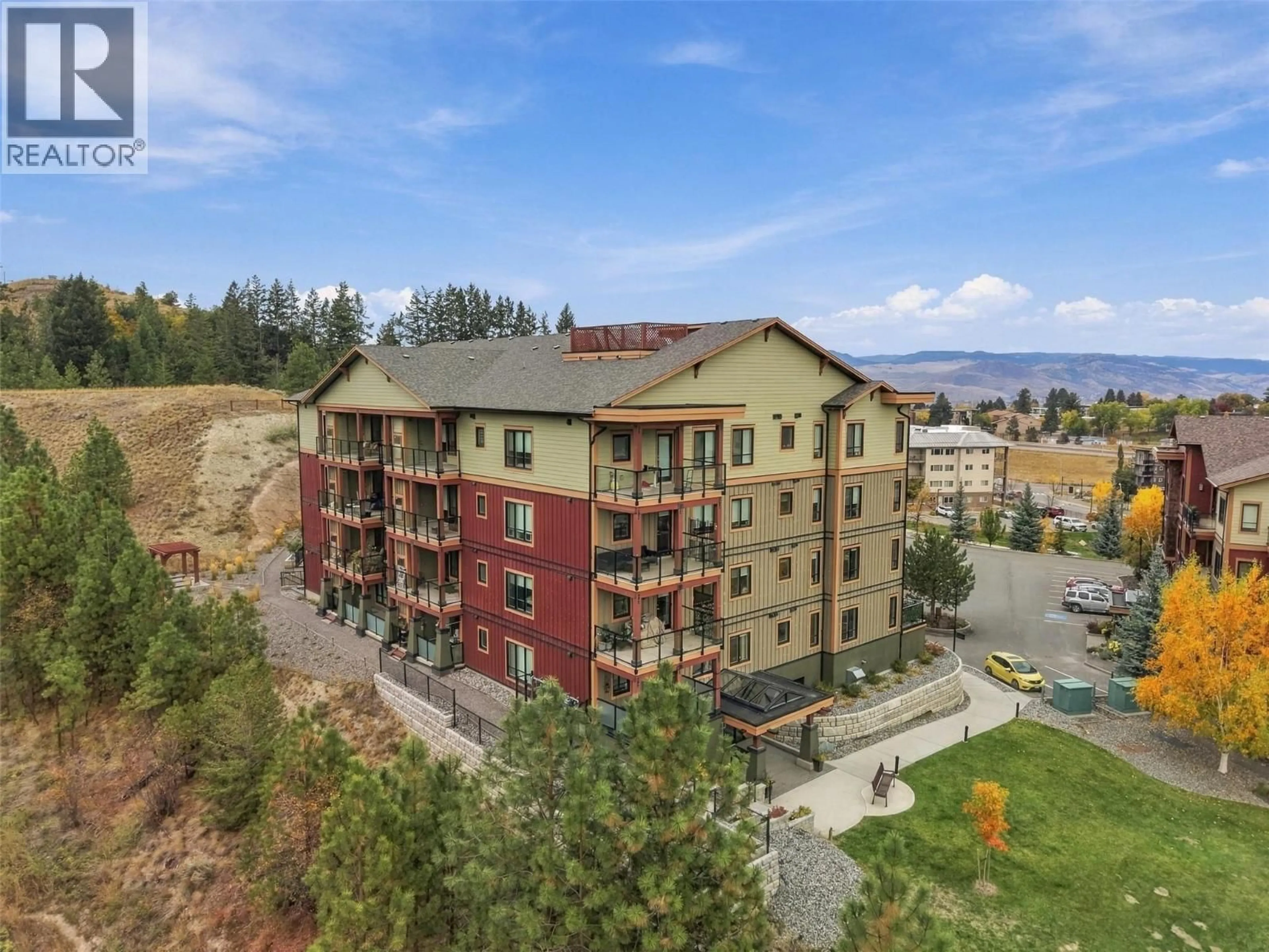 A pic from outside/outdoor area/front of a property/back of a property/a pic from drone, mountain view for 2103 - 1405 SPRINGHILL DRIVE, Kamloops British Columbia V2C0B4