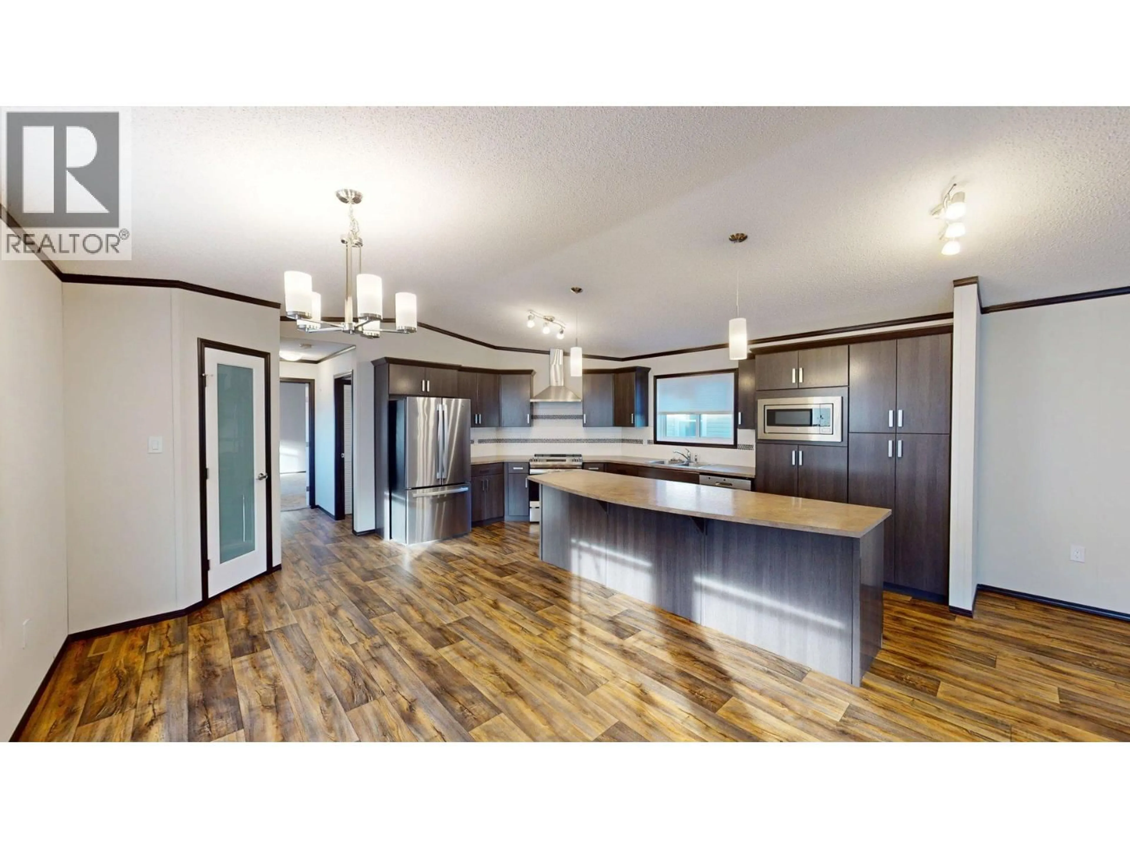 Open concept kitchen, wood/laminate floor for 23 DEERBORNE DRIVE, Elkford British Columbia V0B1H0
