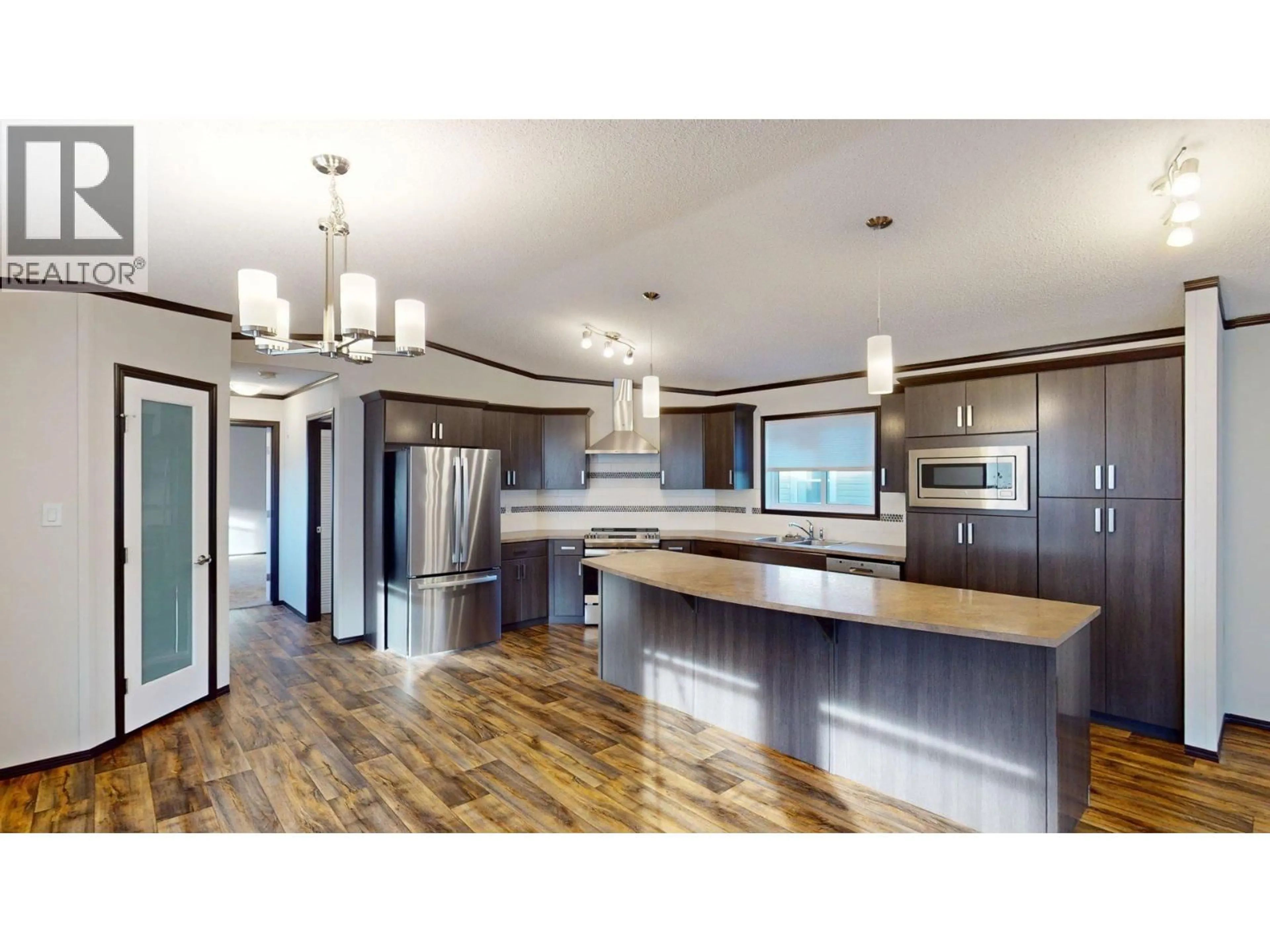 Open concept kitchen, wood/laminate floor for 23 DEERBORNE DRIVE, Elkford British Columbia V0B1H0