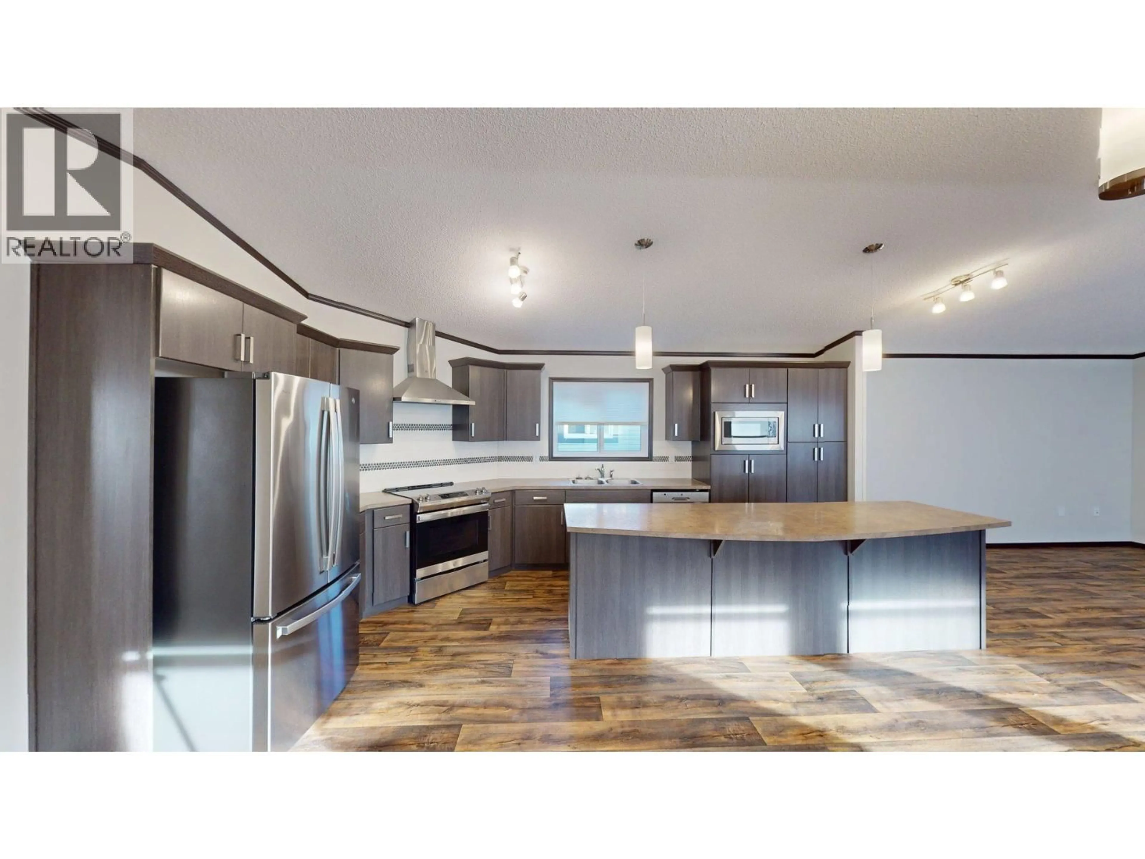 Open concept kitchen, wood/laminate floor for 23 DEERBORNE DRIVE, Elkford British Columbia V0B1H0