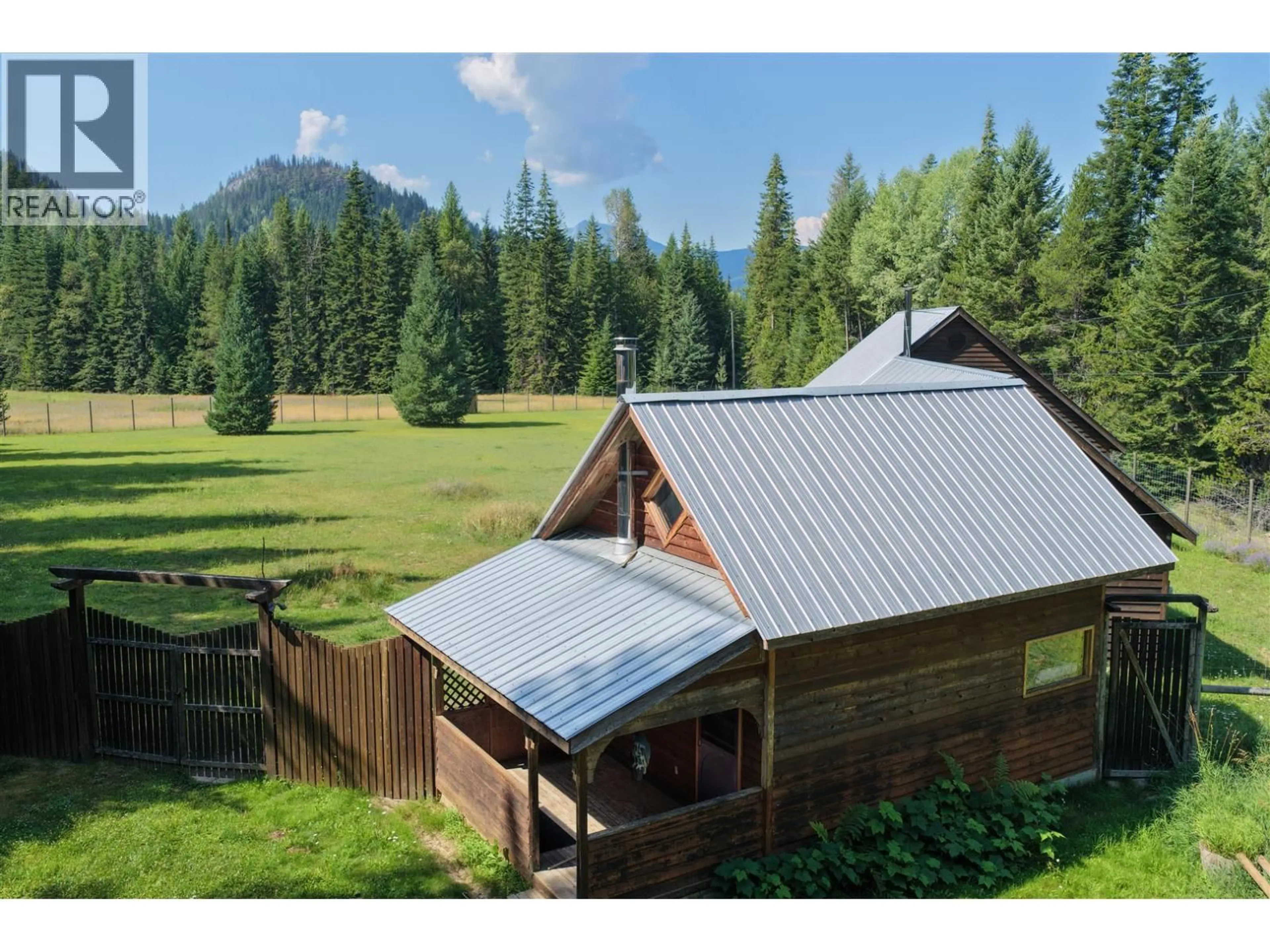 A pic from outside/outdoor area/front of a property/back of a property/a pic from drone, mountain view for 152 TALBOT ROAD, Nelway British Columbia V0G1Z0