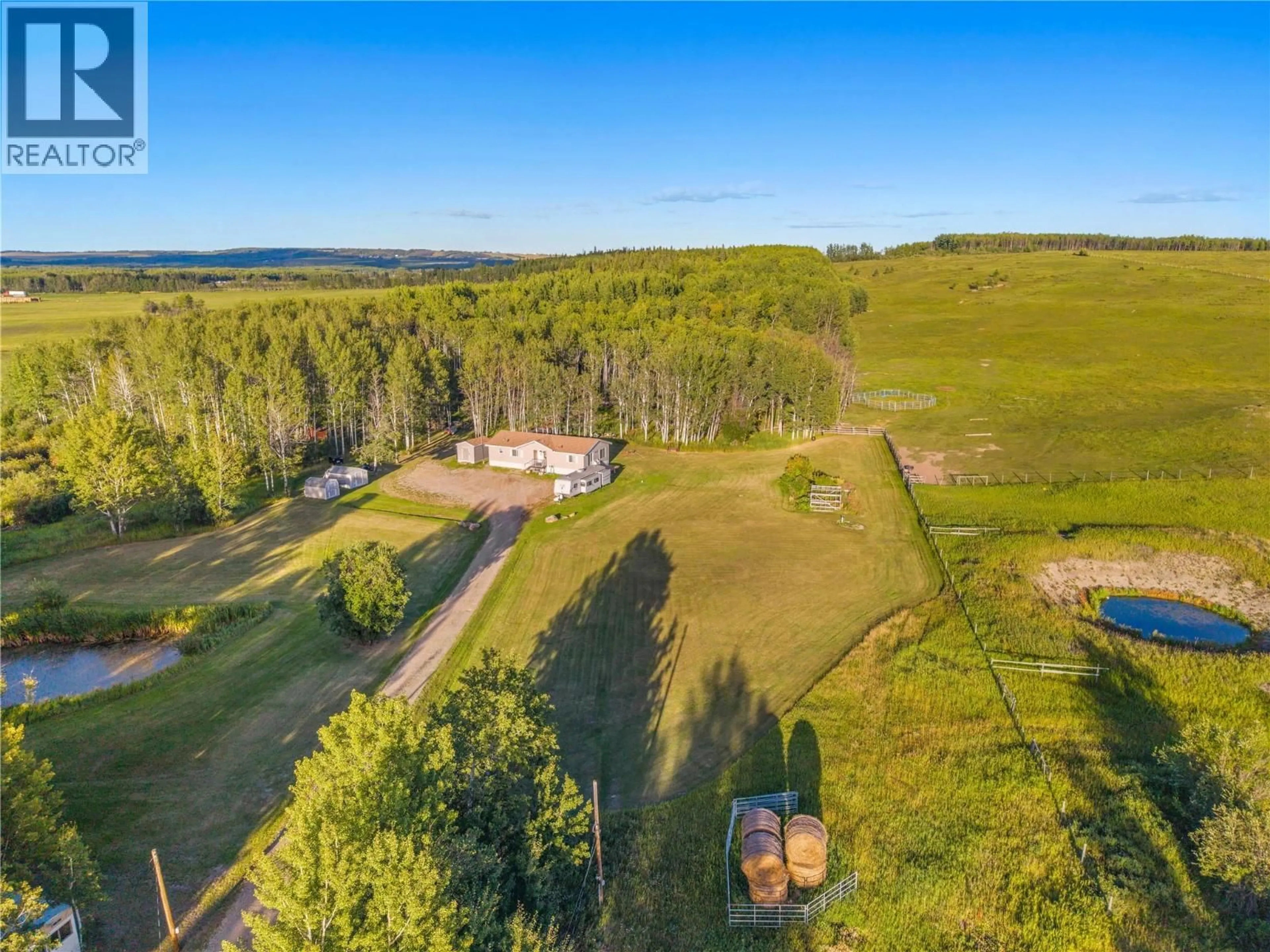 A pic from outside/outdoor area/front of a property/back of a property/a pic from drone, forest/trees view for 9666 251 ROAD, Dawson Creek British Columbia V1G0J2