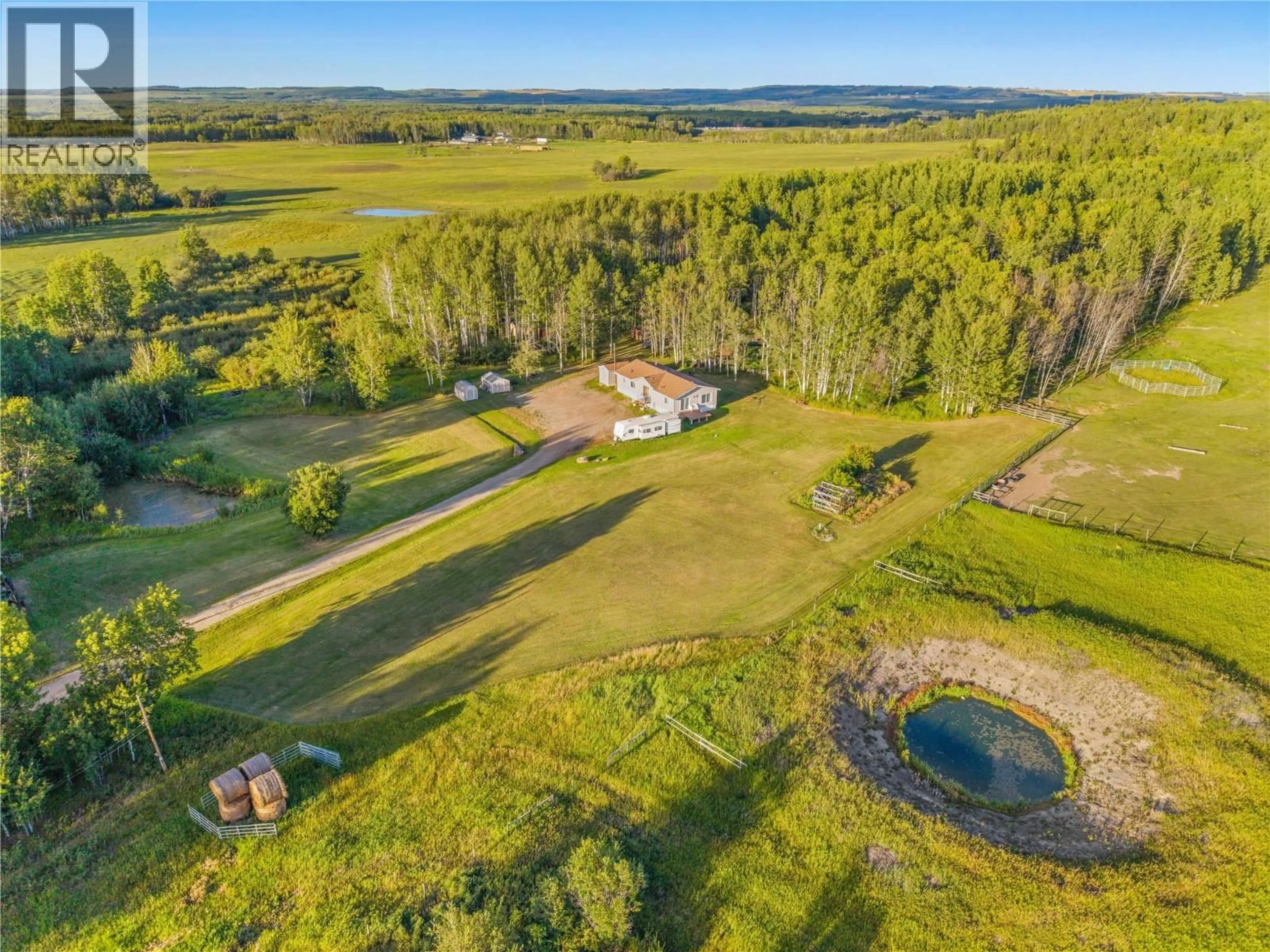 A pic from outside/outdoor area/front of a property/back of a property/a pic from drone, water/lake/river/ocean view for 9666 251 ROAD, Dawson Creek British Columbia V1G0J2