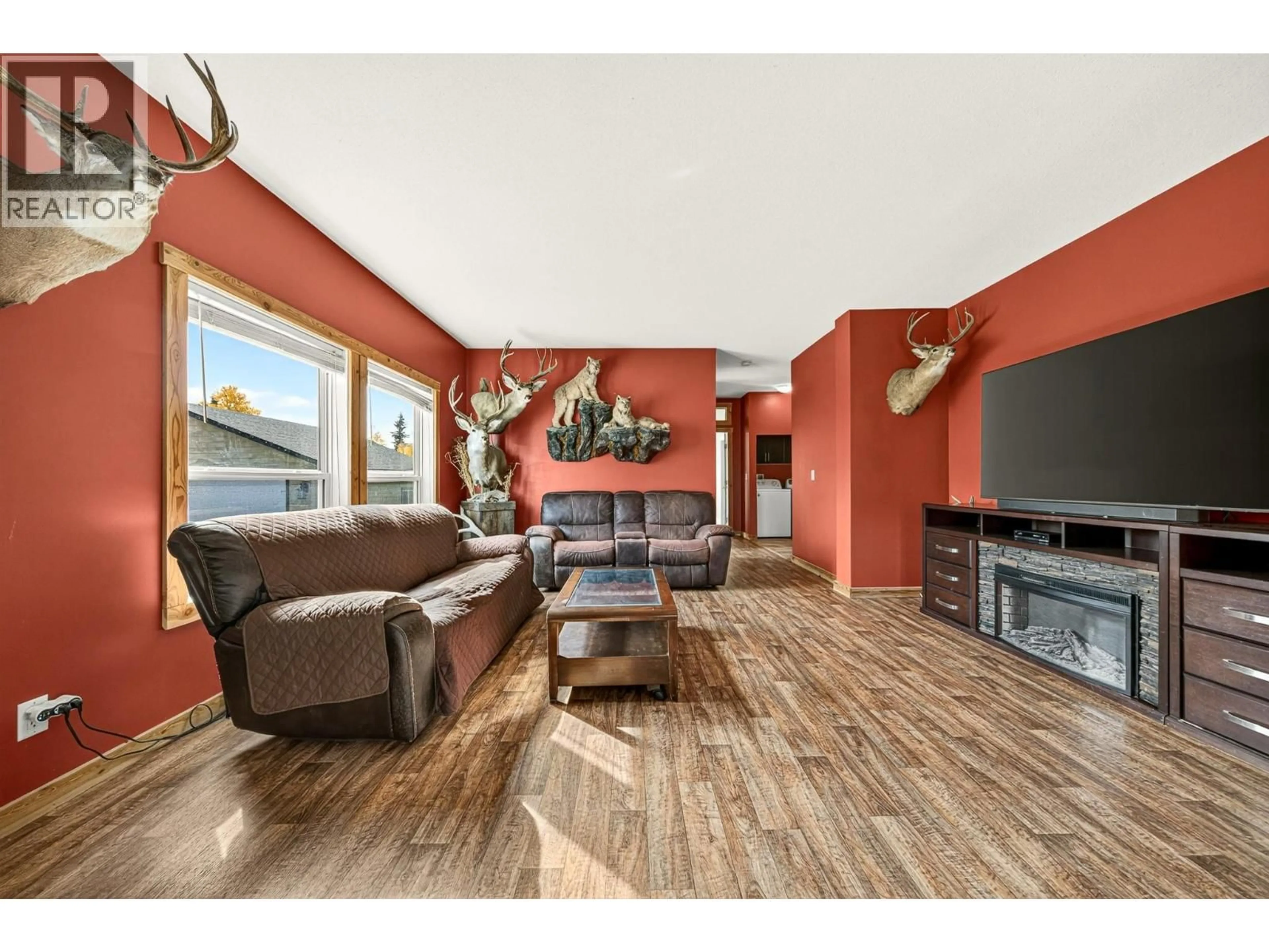 Living room with furniture, wood/laminate floor for 6281 LOWER ELK VALLEY ROAD, Sparwood British Columbia V0B2G3