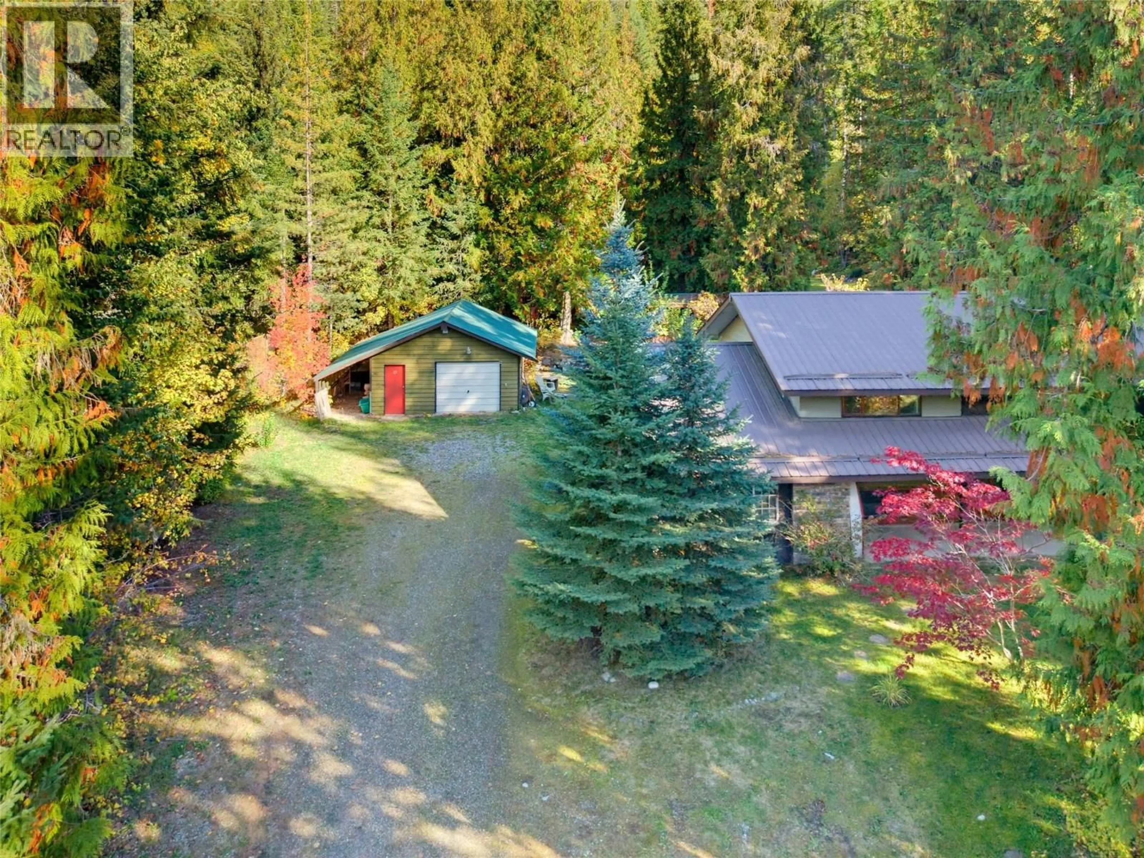 A pic from outside/outdoor area/front of a property/back of a property/a pic from drone, forest/trees view for 9020 HUMMINGBIRD DRIVE, Swansea Point British Columbia V0E2K2