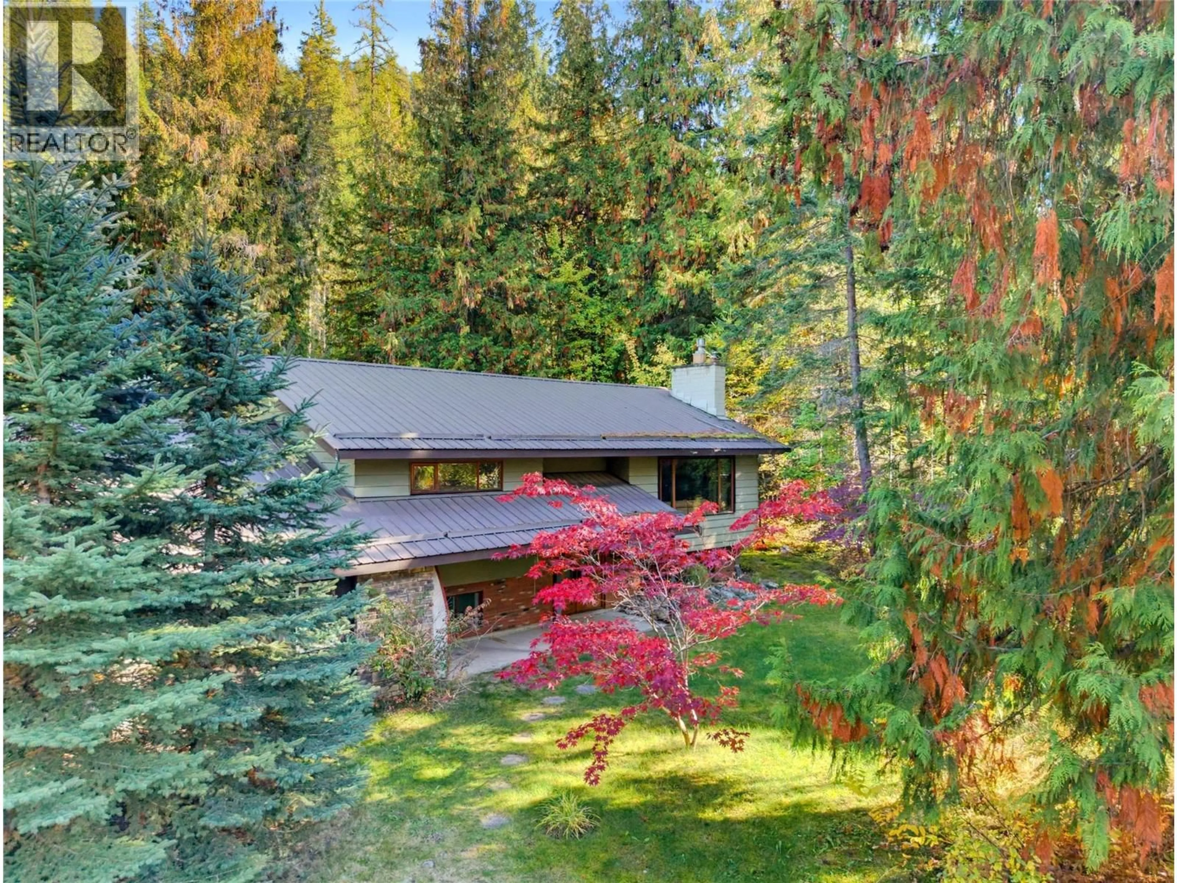 A pic from outside/outdoor area/front of a property/back of a property/a pic from drone, forest/trees view for 9020 HUMMINGBIRD DRIVE, Swansea Point British Columbia V0E2K2