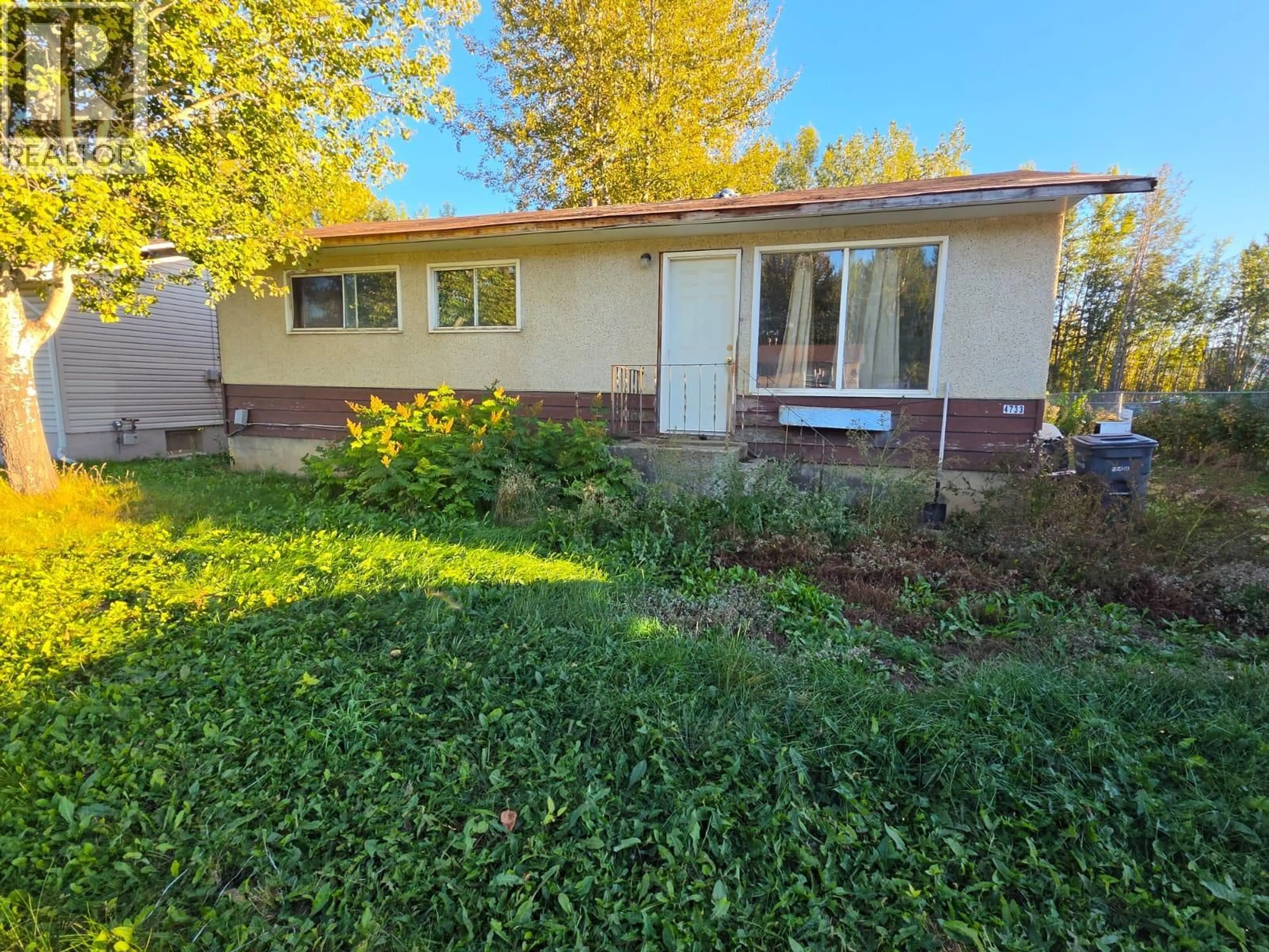 Home with vinyl exterior material, street for 4733 WABI CRESCENT SOUTHEAST, Chetwynd British Columbia V0C1J0