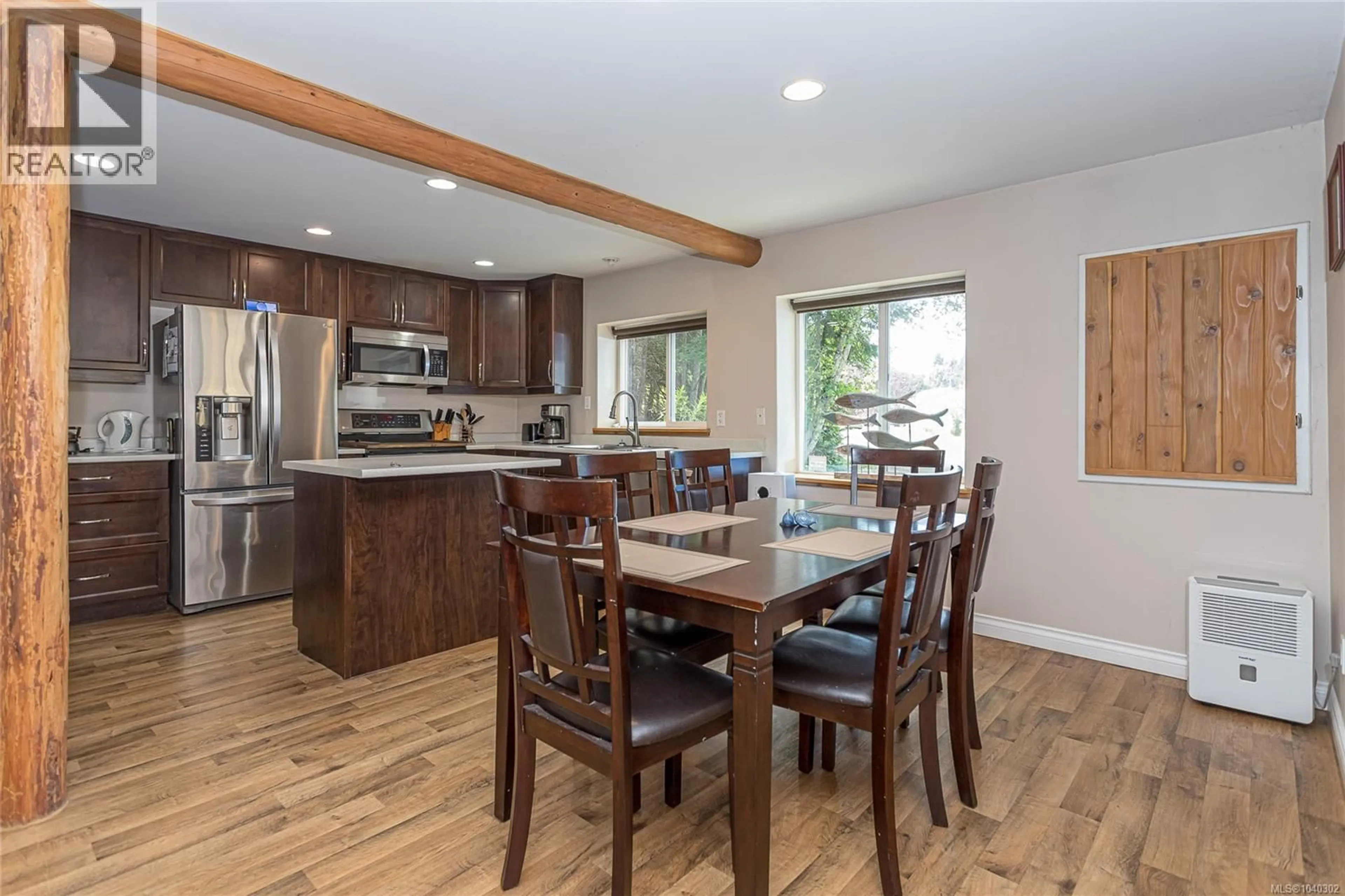 Open concept kitchen, wood/laminate floor for 70 ISLEWOOD DRIVE, Bowser British Columbia V0R1G0
