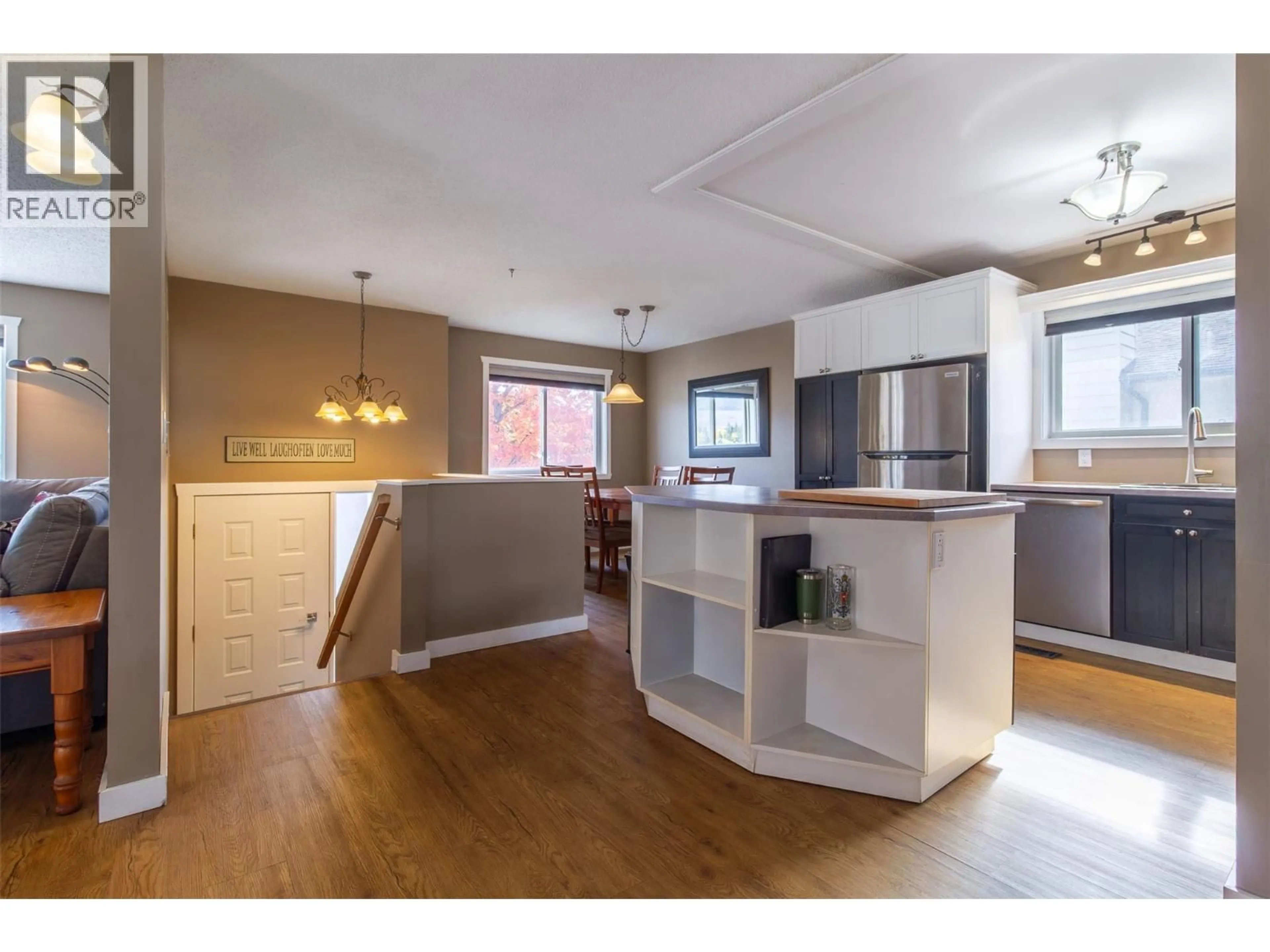 Open concept kitchen, wood/laminate floor for 1207 PINYON ROAD, Sparwood British Columbia V0B2G2