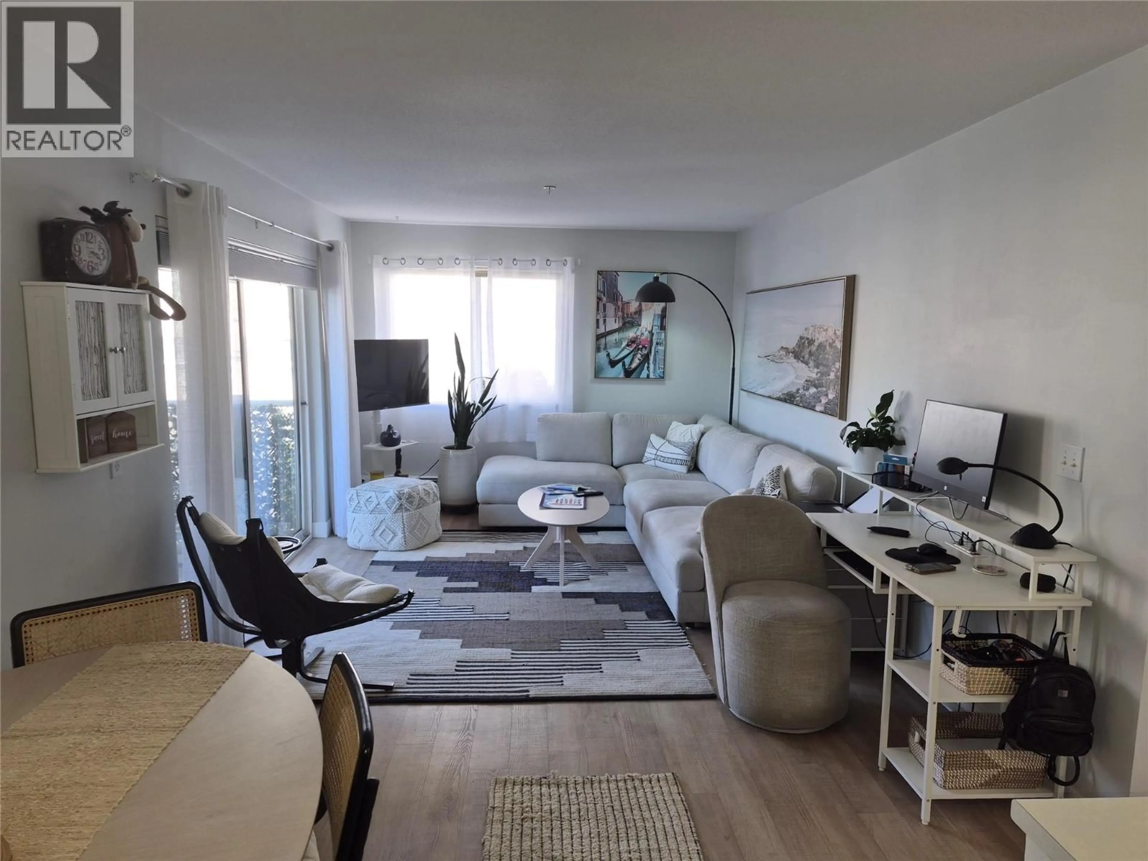 Living room with furniture, wood/laminate floor for 204 - 360 BATTLE STREET, Kamloops British Columbia V2C2L6