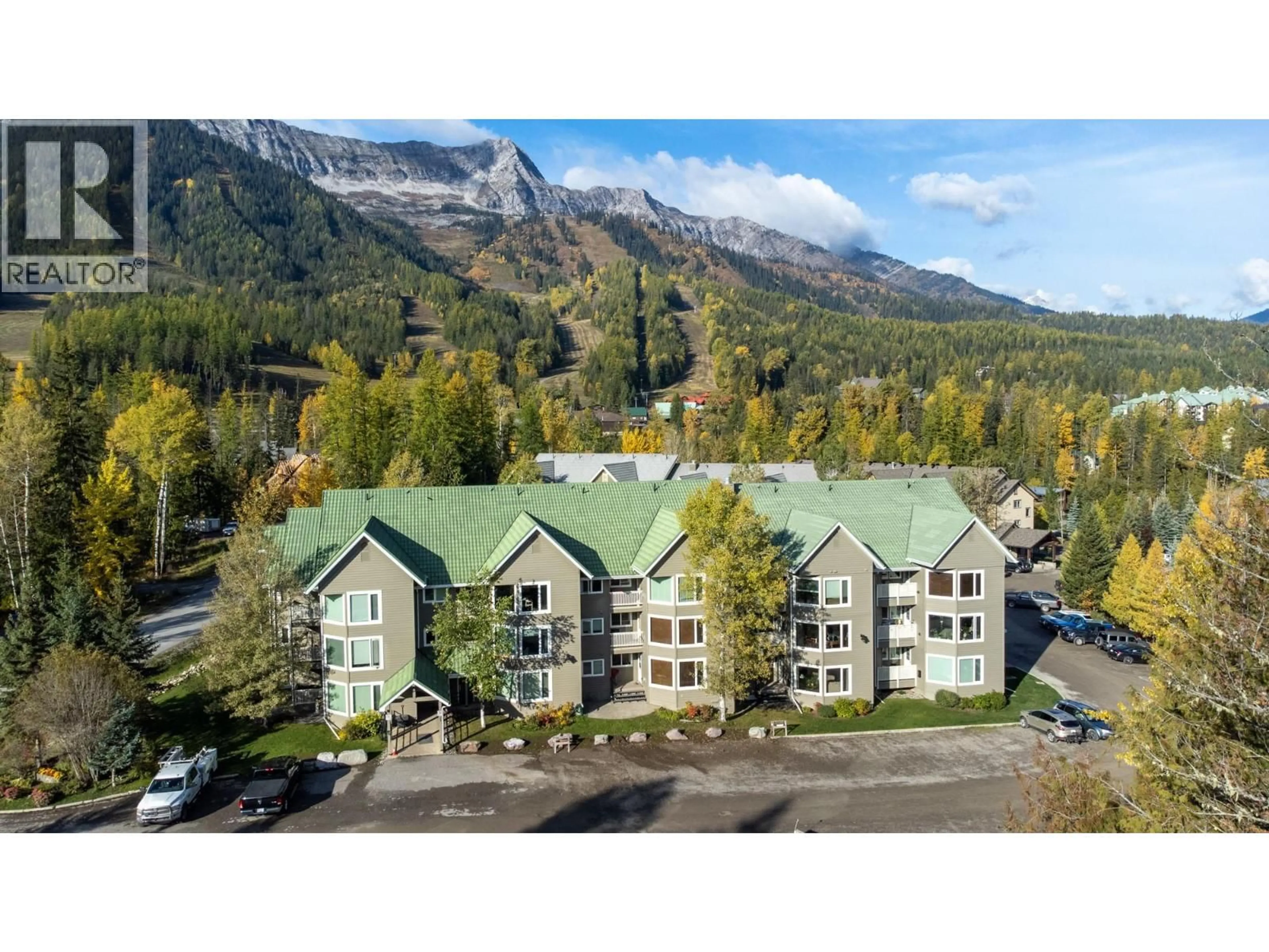 A pic from outside/outdoor area/front of a property/back of a property/a pic from drone, mountain view for 101-4559 TIMBERLINE CRESCENT, Fernie British Columbia V0B1M6