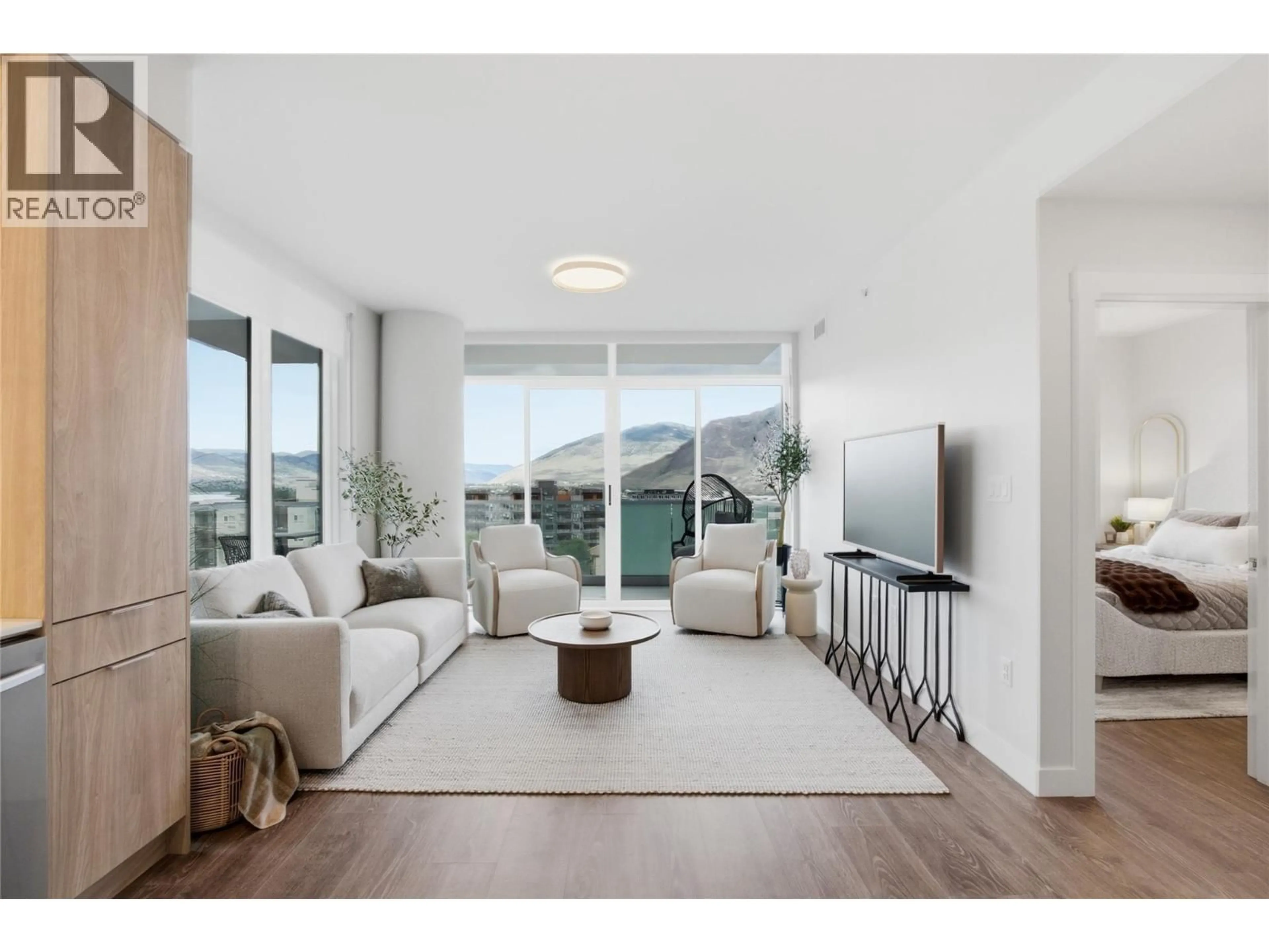 Living room with furniture, wood/laminate floor for 508 - 460 NICOLA STREET, Kamloops British Columbia V2C0N2