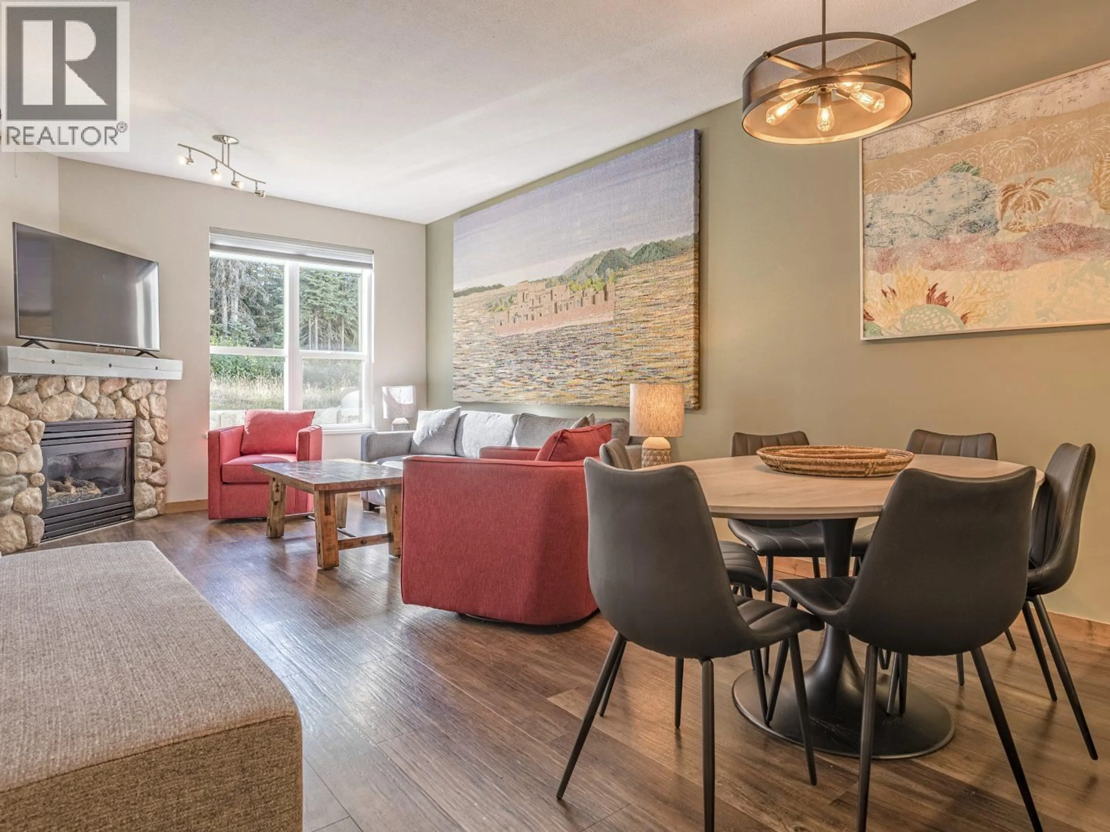 Living room with furniture, wood/laminate floor for 109 - 9808 SILVER STAR ROAD, Vernon British Columbia V1B3X4