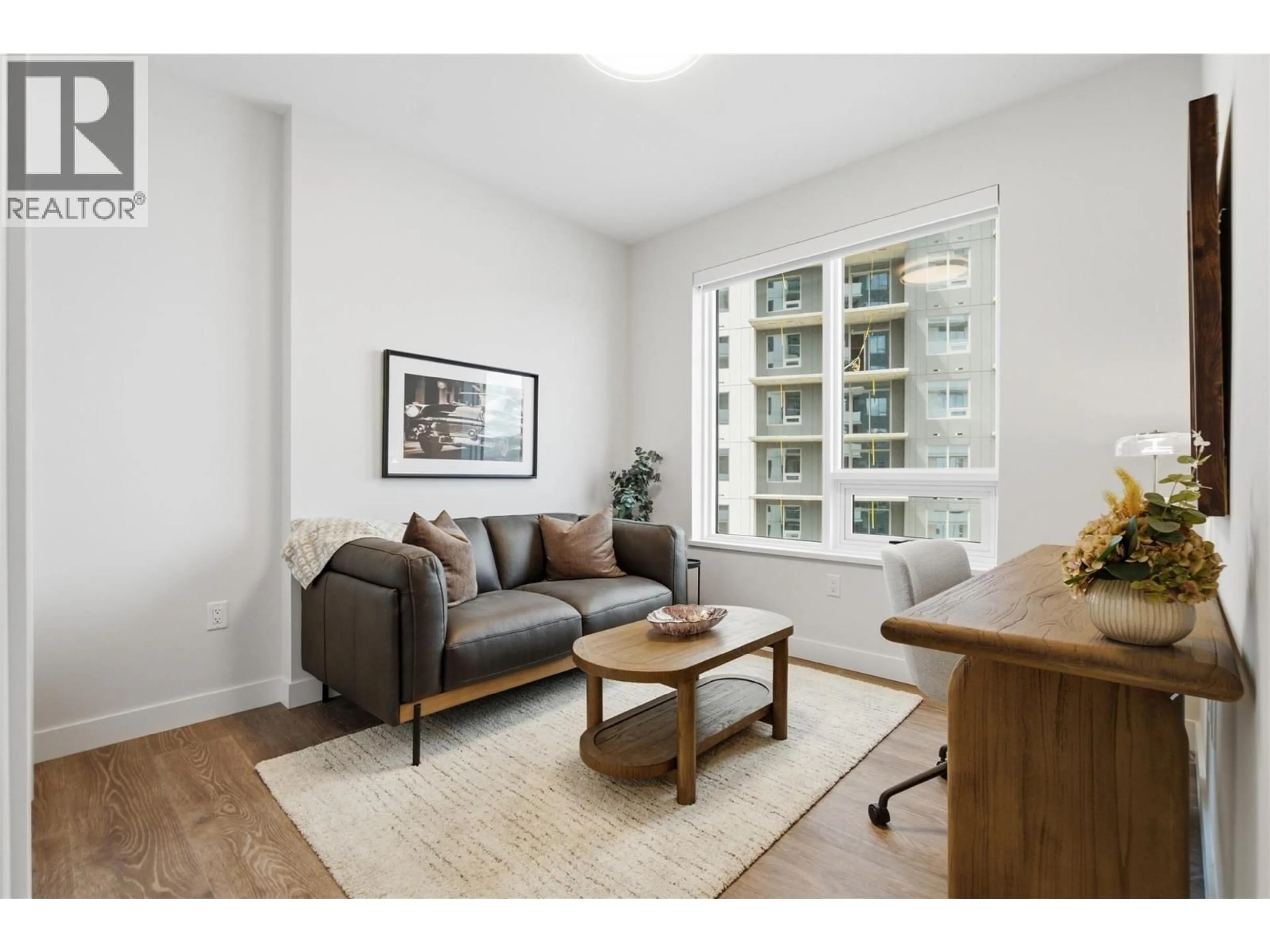 Living room with furniture, wood/laminate floor for 1008 - 460 NICOLA STREET, Kamloops British Columbia V2C0N2