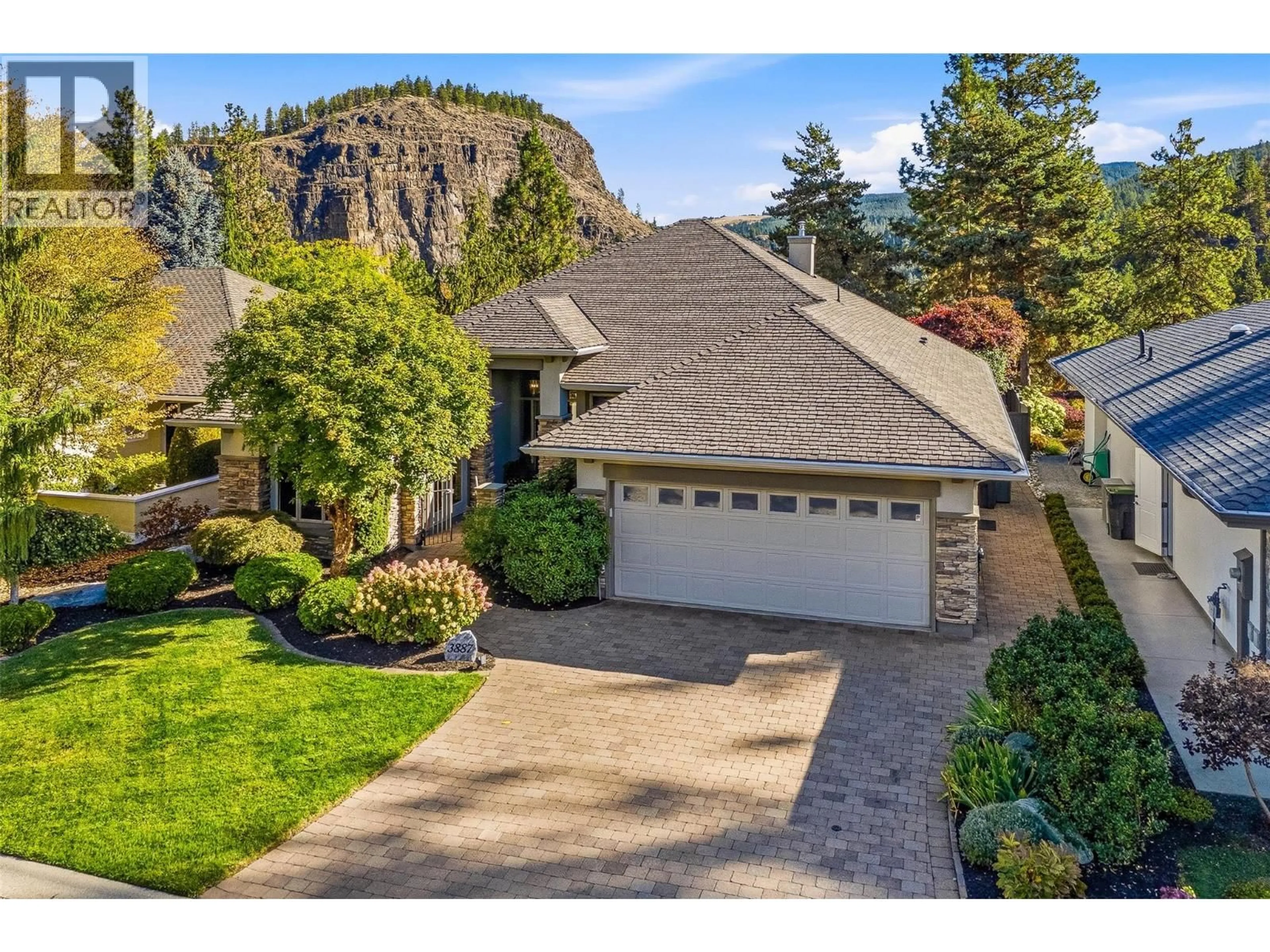 A pic from outside/outdoor area/front of a property/back of a property/a pic from drone, mountain view for 3887 GALLAGHERS PARKWAY, Kelowna British Columbia V1W3Z8