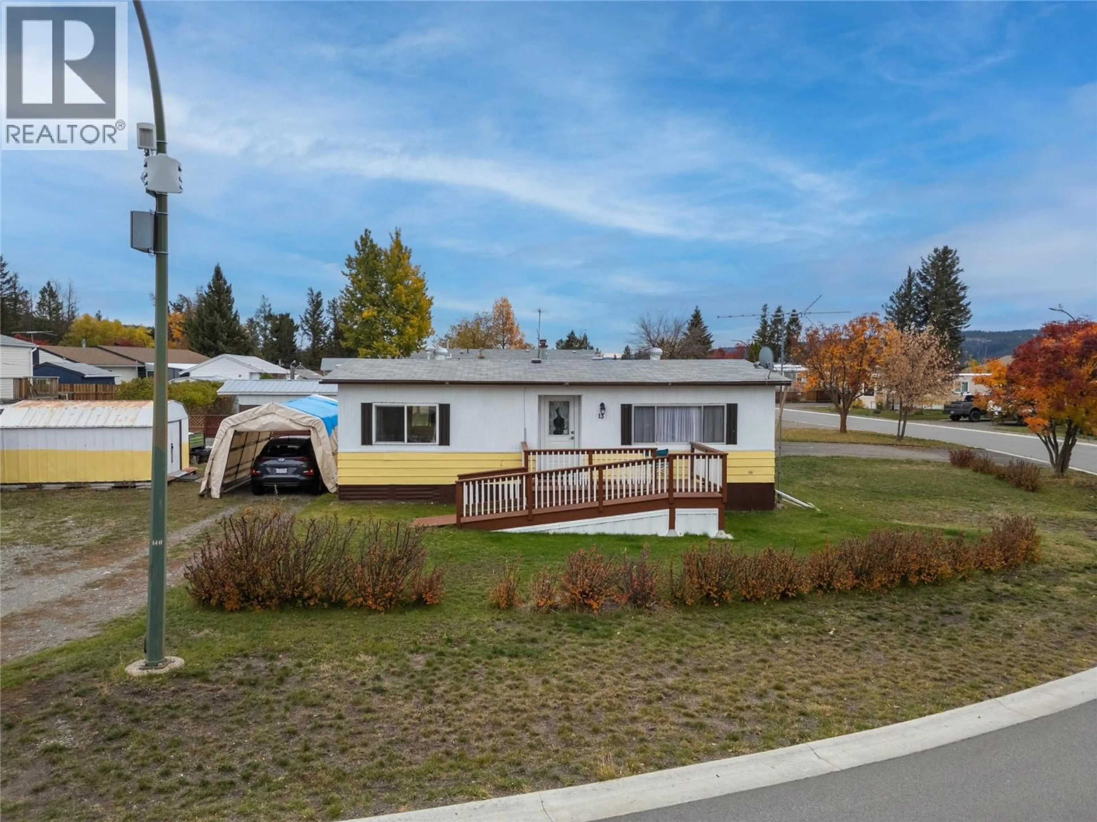 Home with vinyl exterior material, street for 13 TOPAZ CRESCENT, Logan Lake British Columbia V0K1W0
