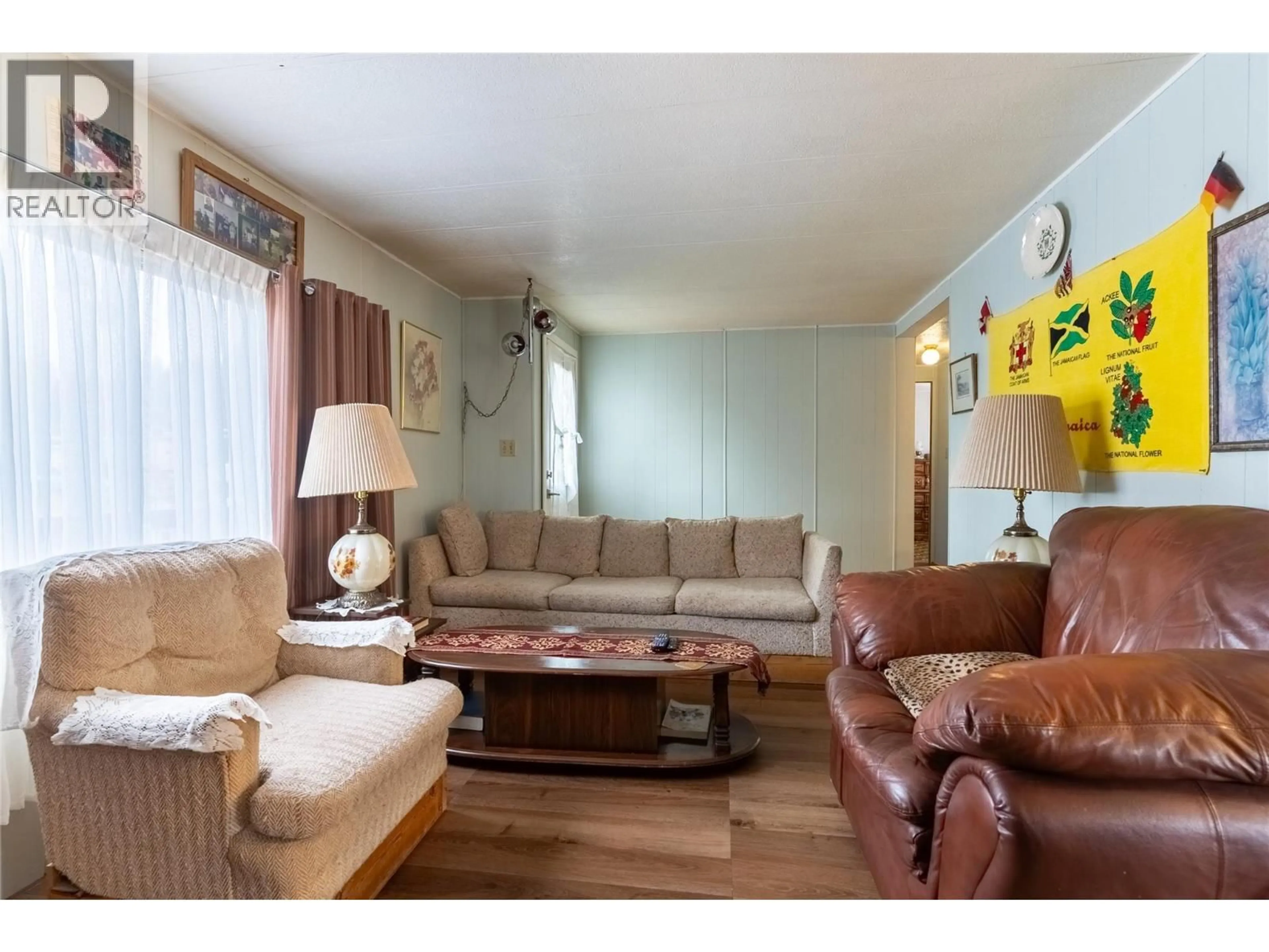 Living room with furniture, wood/laminate floor for 13 TOPAZ CRESCENT, Logan Lake British Columbia V0K1W0