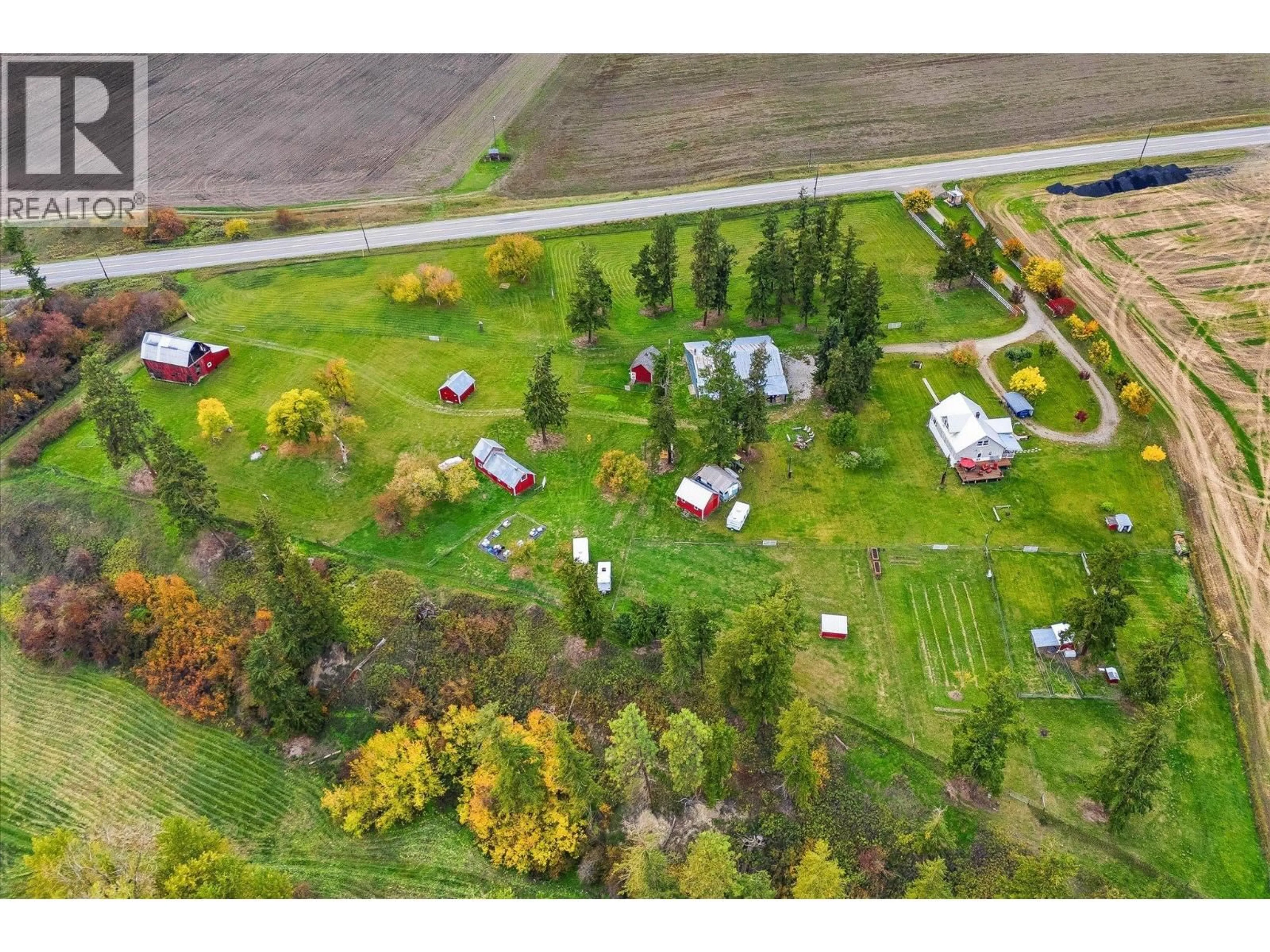 A pic from outside/outdoor area/front of a property/back of a property/a pic from drone, street for 4652 HIGHWAY 97A OTHER, Armstrong British Columbia V0E1B7