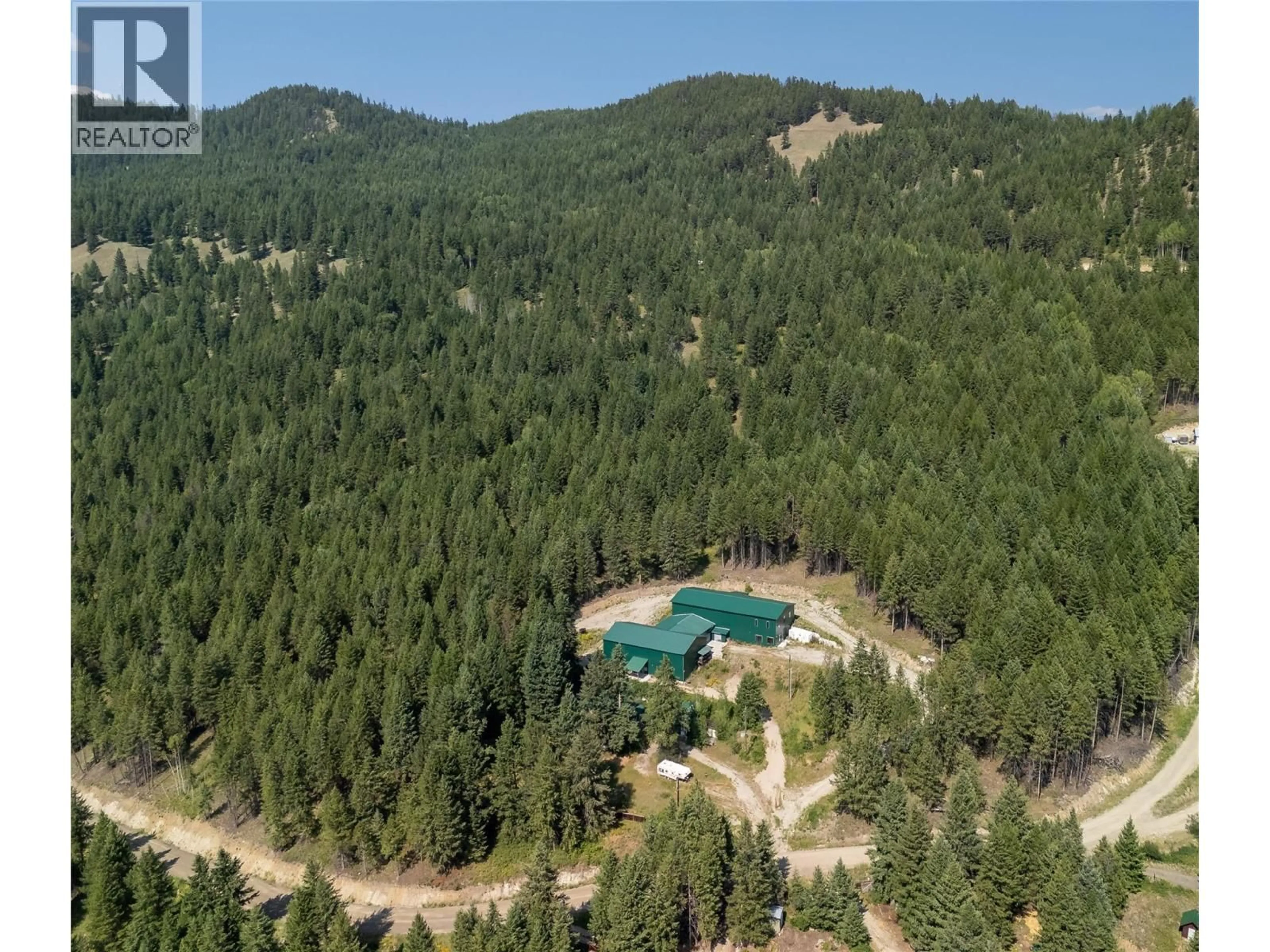 A pic from outside/outdoor area/front of a property/back of a property/a pic from drone, forest/trees view for 225 BOULDER ROAD, Beaverdell British Columbia V0H1A0