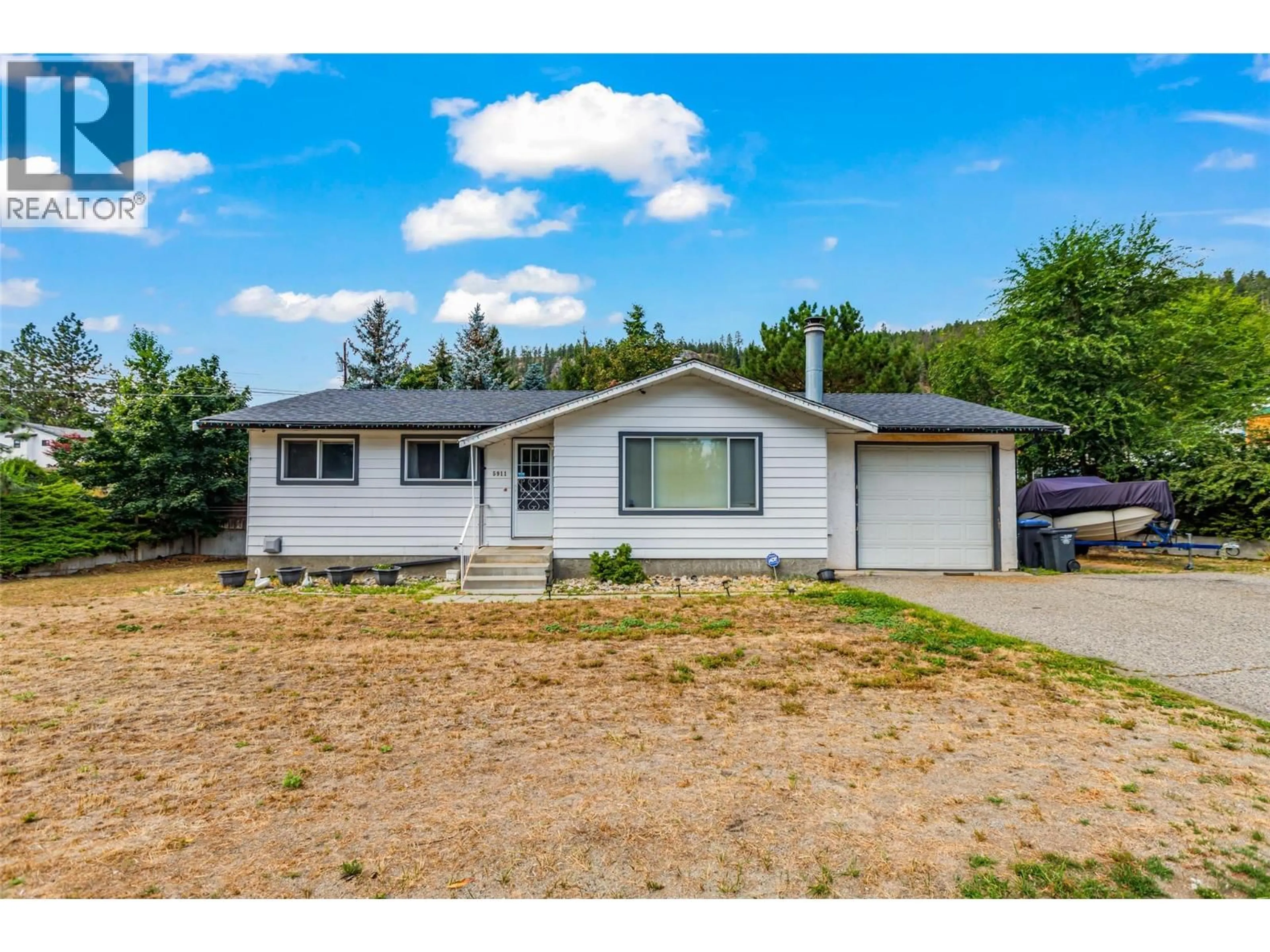 A pic from outside/outdoor area/front of a property/back of a property/a pic from drone, street for 5911 EHLERS ROAD, Peachland British Columbia V0H1X0