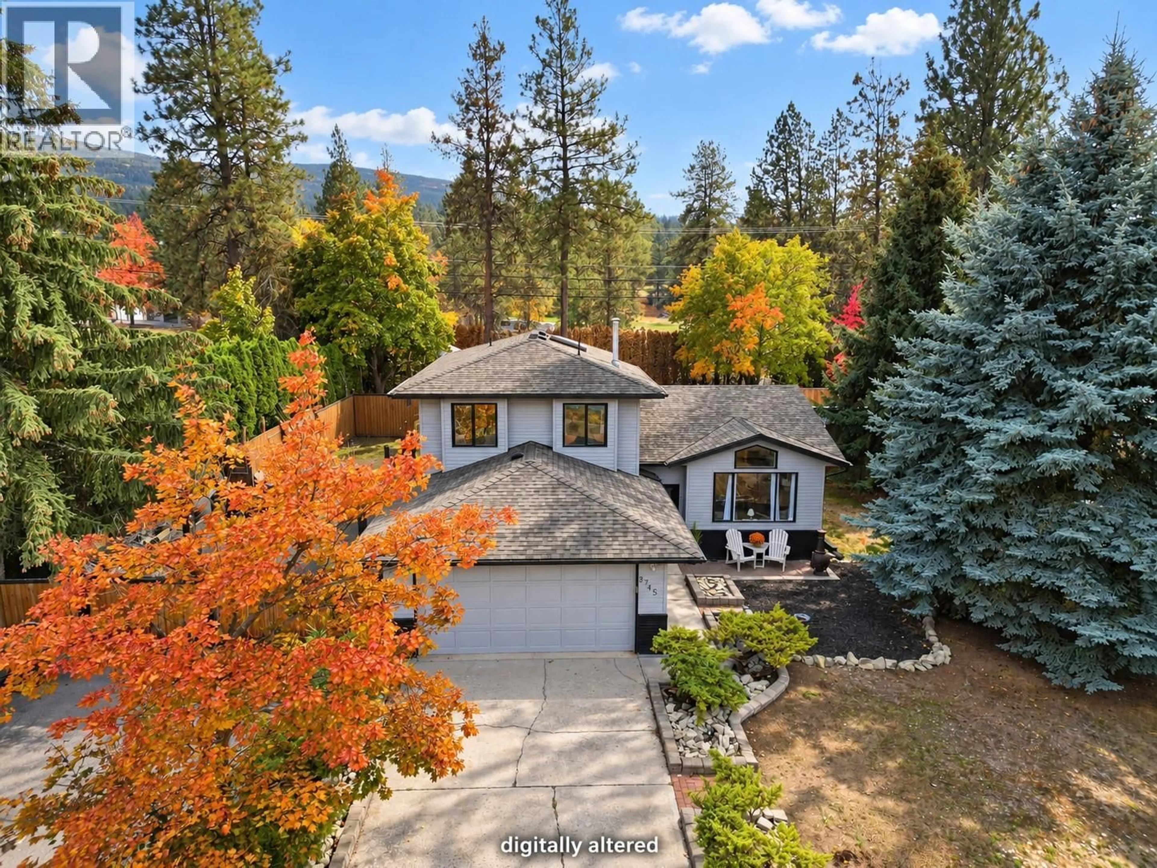 A pic from outside/outdoor area/front of a property/back of a property/a pic from drone, forest/trees view for 3745 KIMATOUCHE ROAD, Kelowna British Columbia V1Y7R2