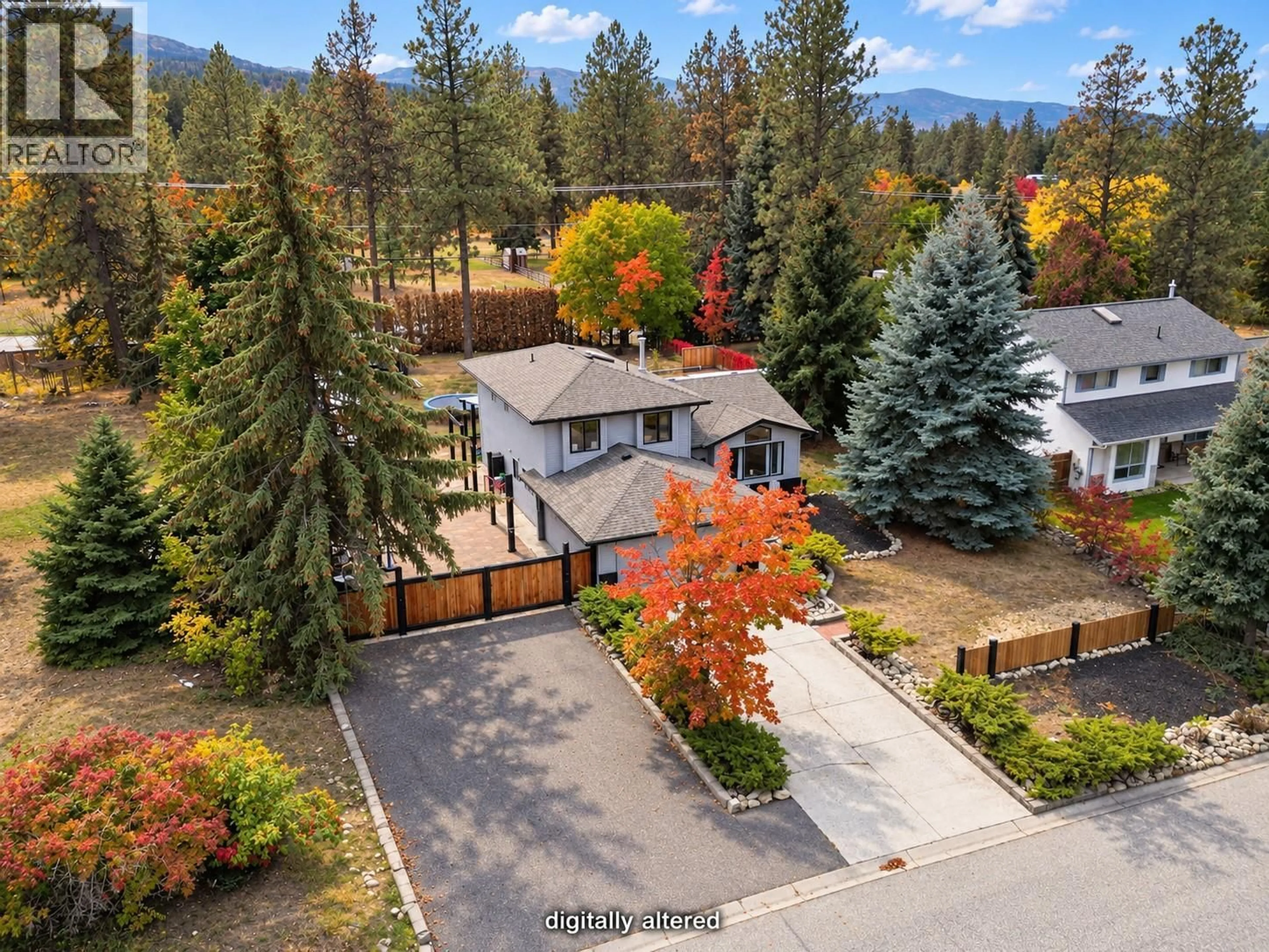A pic from outside/outdoor area/front of a property/back of a property/a pic from drone, mountain view for 3745 KIMATOUCHE ROAD, Kelowna British Columbia V1Y7R2