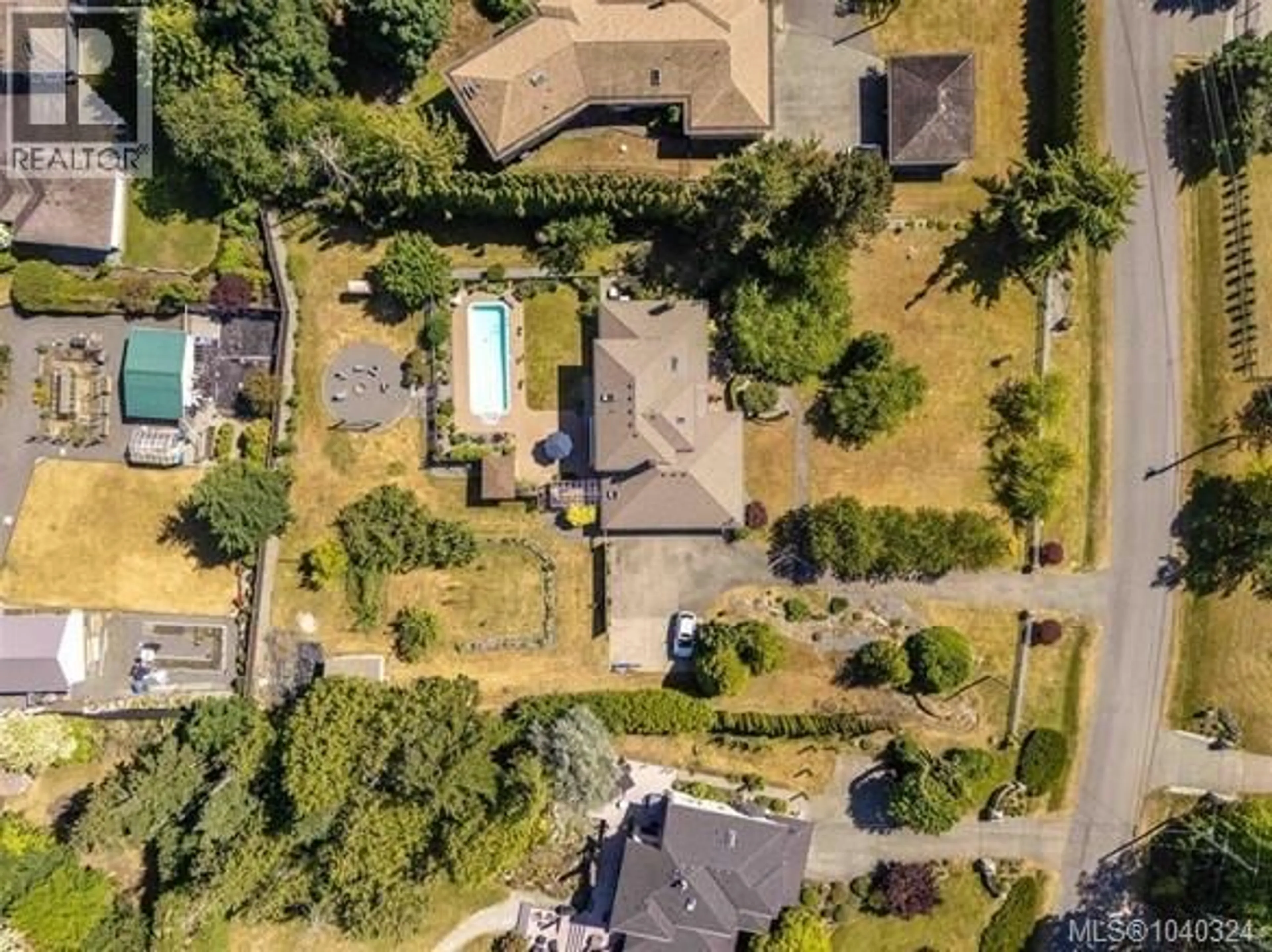 A pic from outside/outdoor area/front of a property/back of a property/a pic from drone, street for 11109 TANAGER ROAD, North Saanich British Columbia V8L5N5