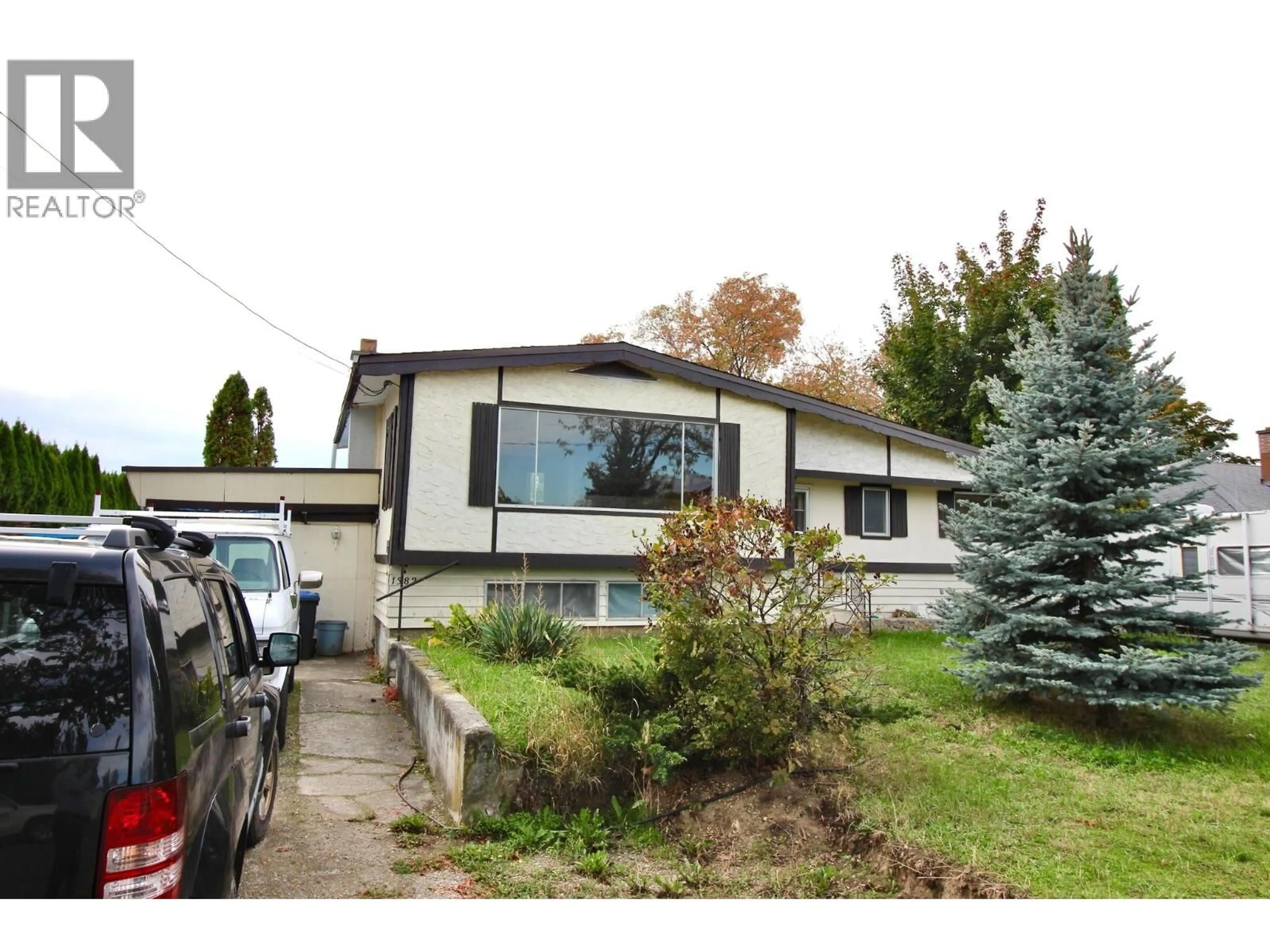 Home with vinyl exterior material, street for 1382 MCBRIDE ROAD ROAD, Kelowna British Columbia V1Y4A6