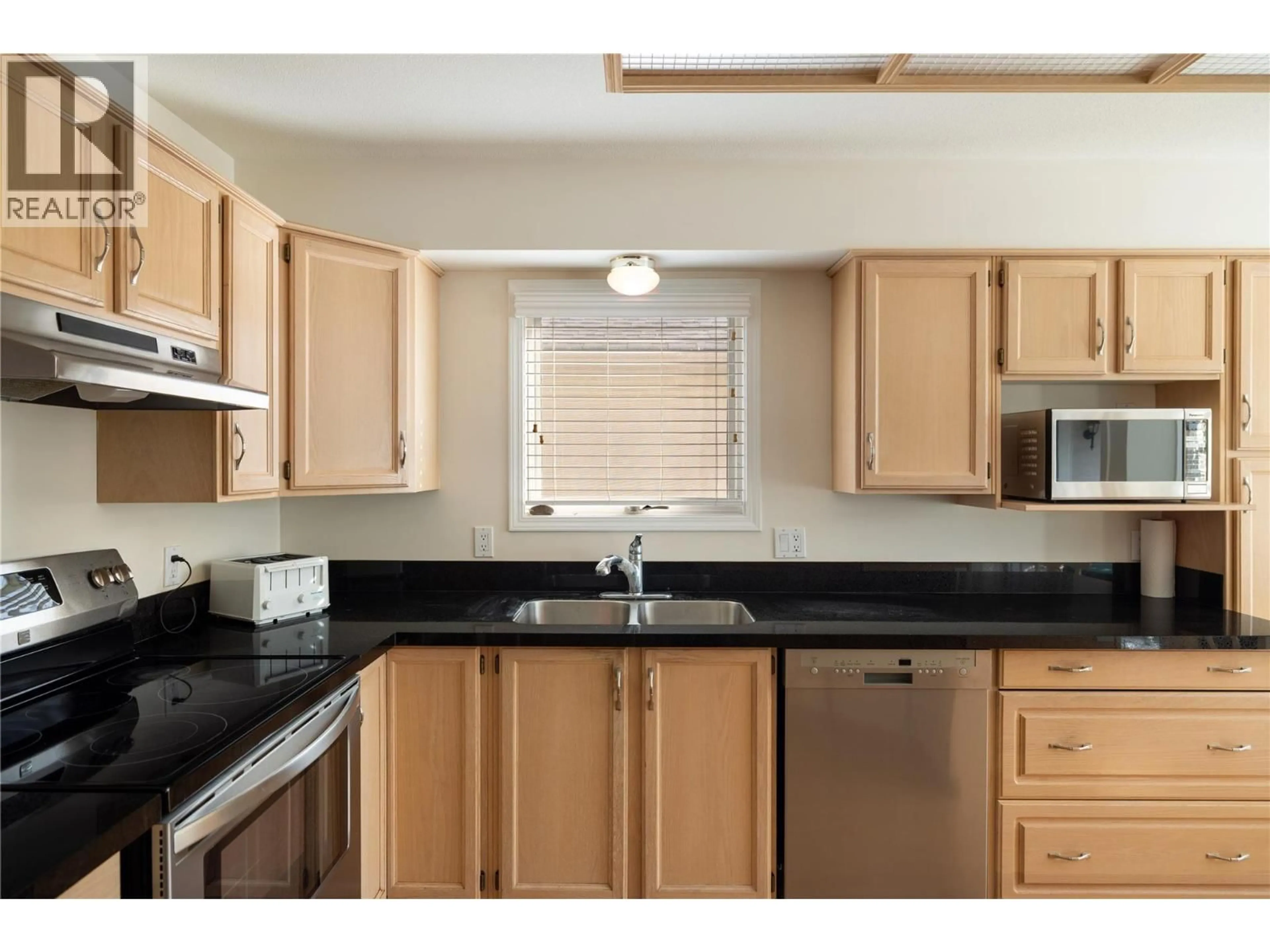 Standard kitchen, wood/laminate floor for 85 - 595 YATES ROAD, Kelowna British Columbia V1V1P8