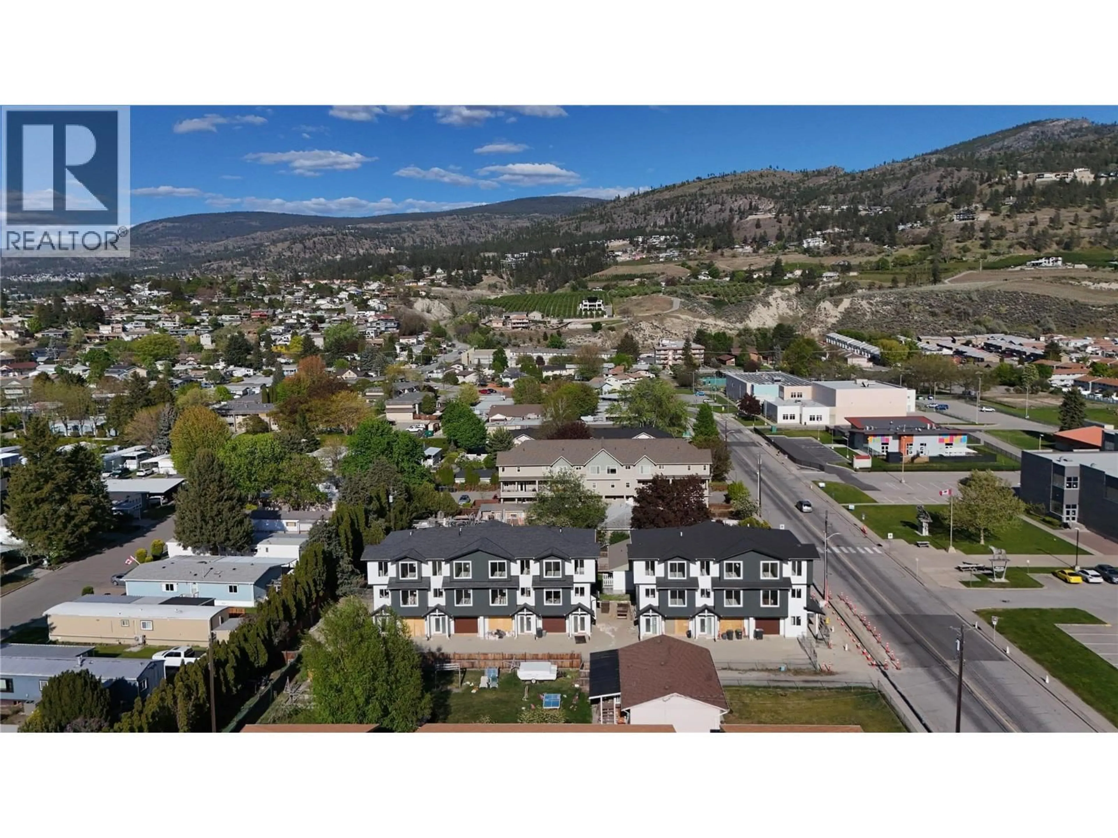 A pic from outside/outdoor area/front of a property/back of a property/a pic from drone, mountain view for 103 - 143 GREEN AVENUE, Penticton British Columbia V2A3S9