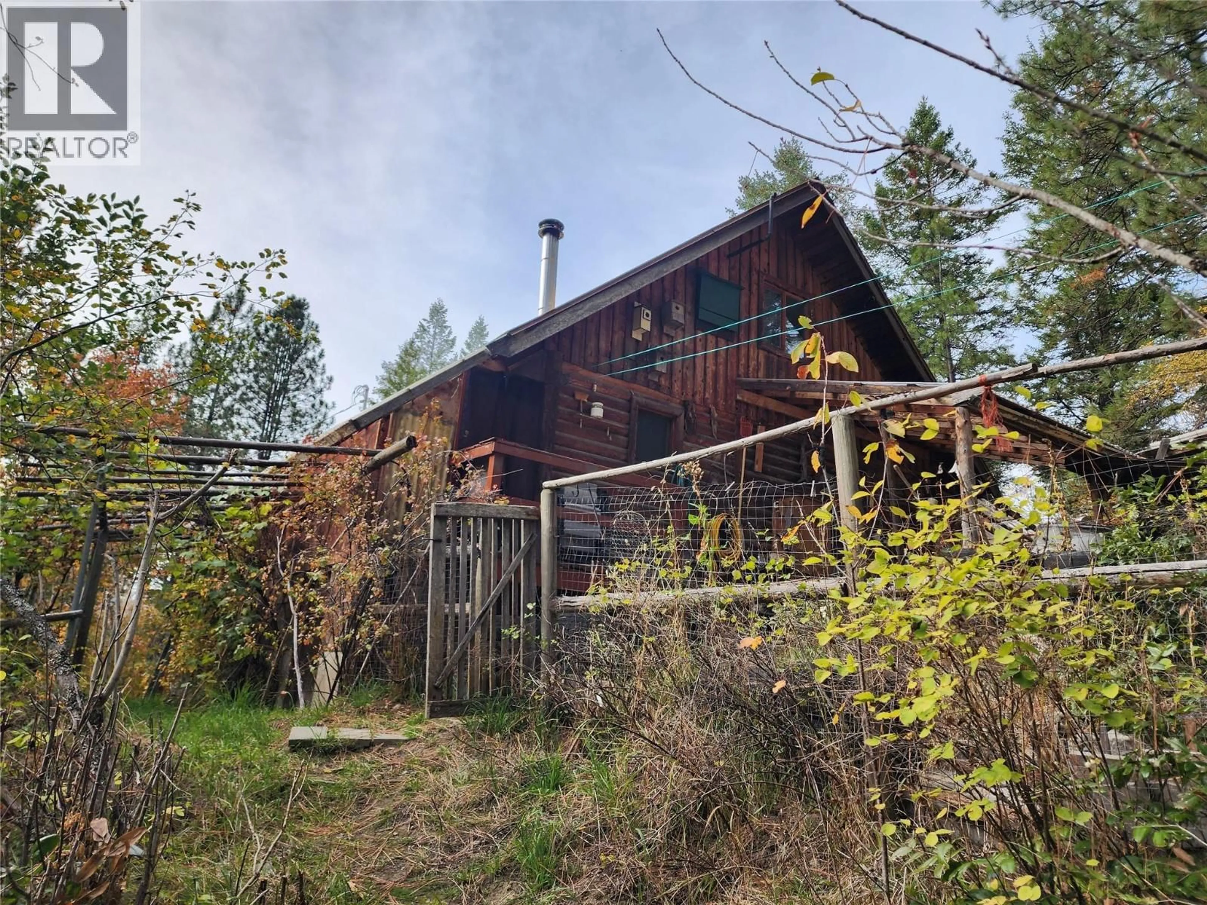 A pic from outside/outdoor area/front of a property/back of a property/a pic from drone, forest/trees view for 1905 &1910 SNOWBALL CREEK EAST ROAD, Grand Forks British Columbia V0H1H1