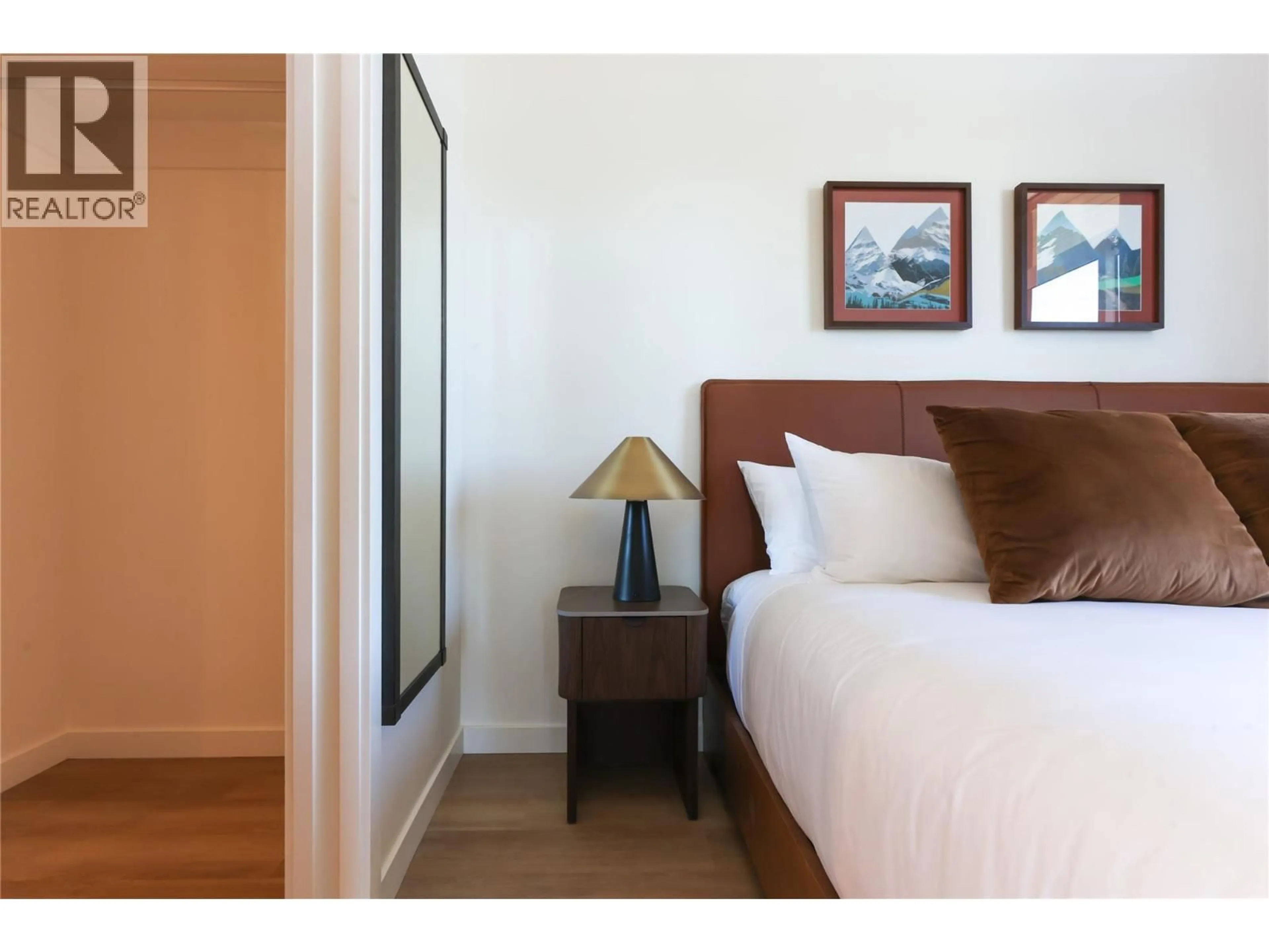Bedroom with bed, wood/laminate floor for 608 - 4240 RED MOUNTAIN ROAD, Rossland British Columbia V0G1Y0