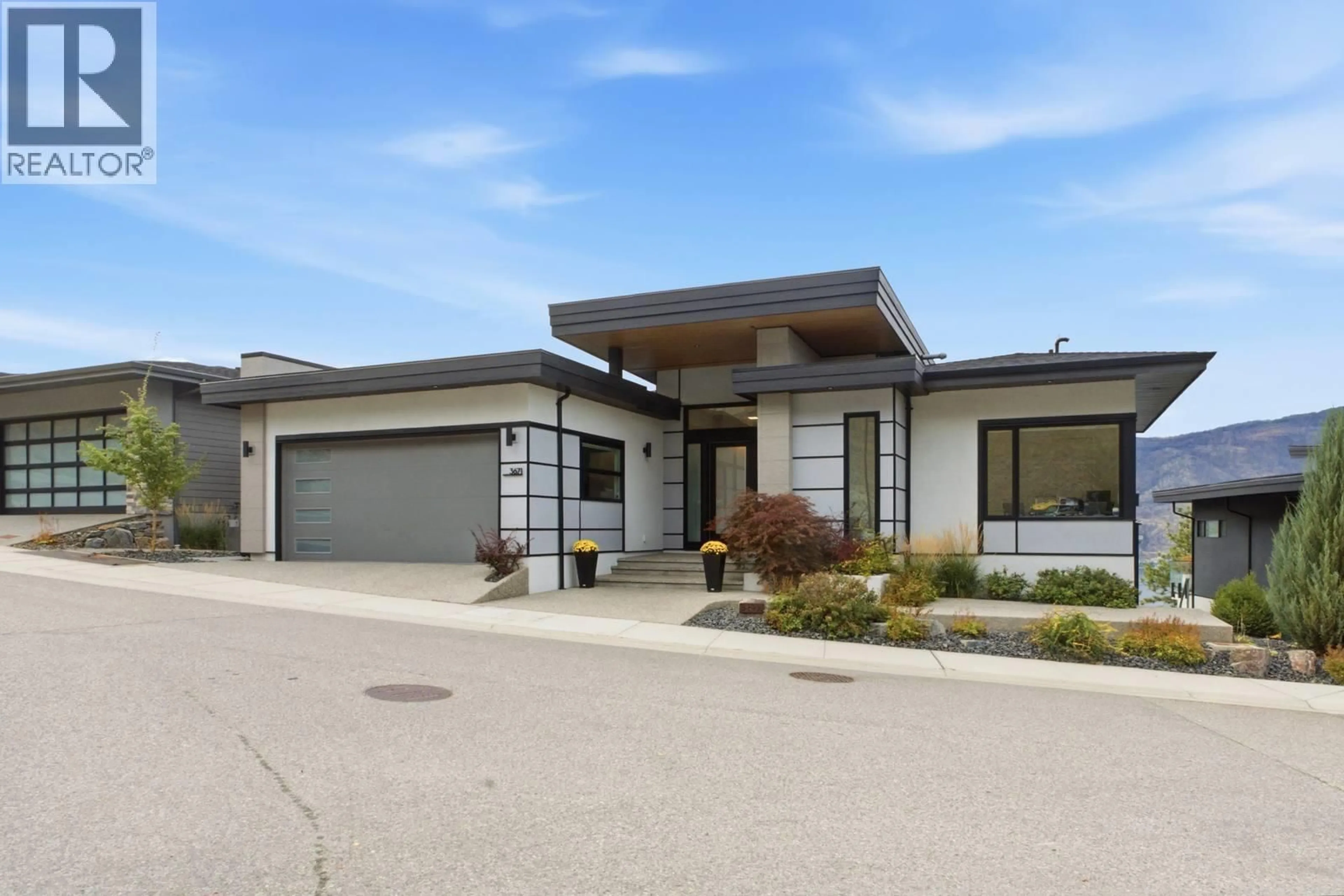 Home with vinyl exterior material, street for 3671 MCKINLEY BEACH DRIVE, Kelowna British Columbia V1V3G2