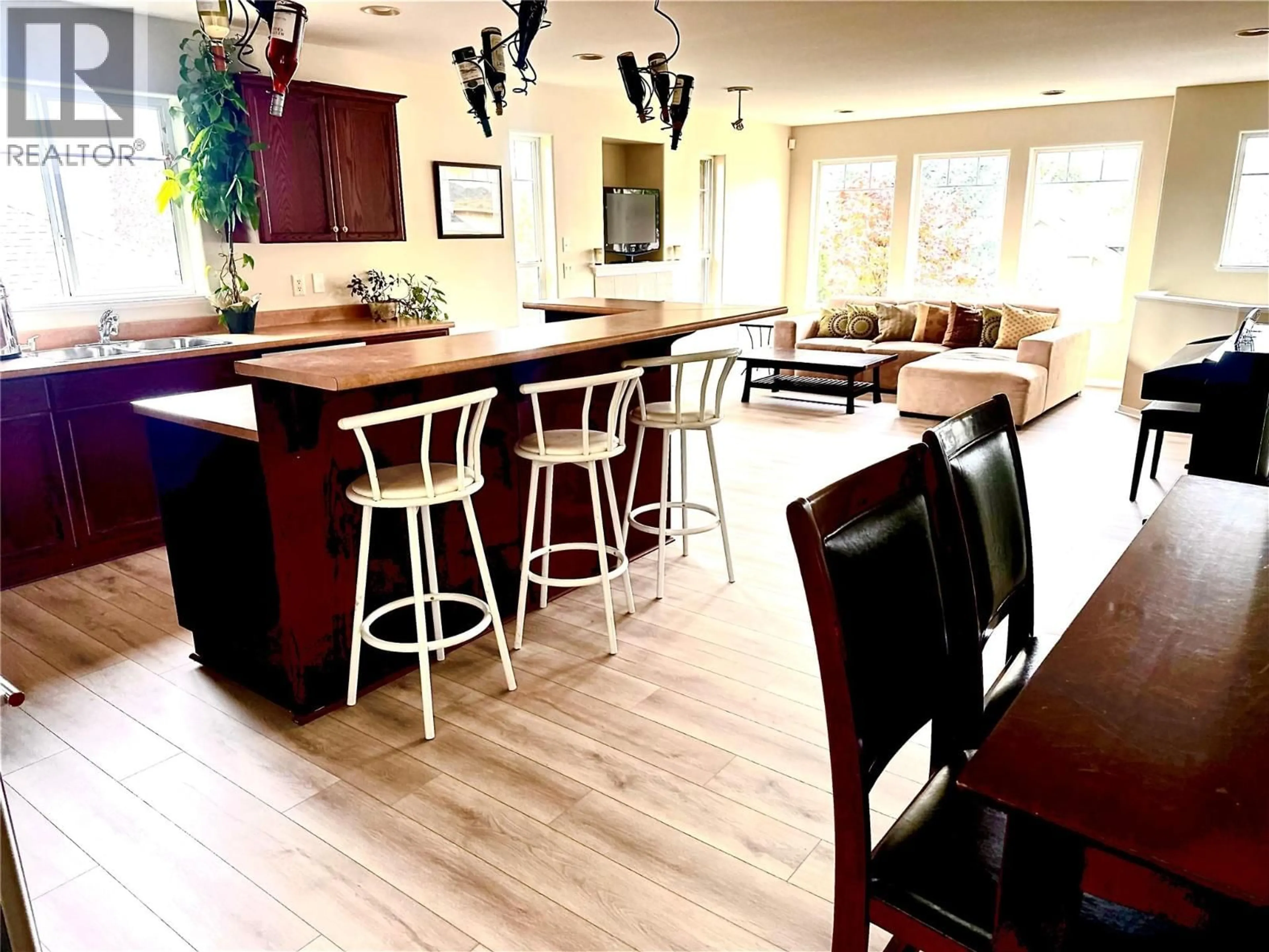 Open concept kitchen, wood/laminate floor for 2145 CHILCOTIN CRESCENT, Kelowna British Columbia V1V2N9