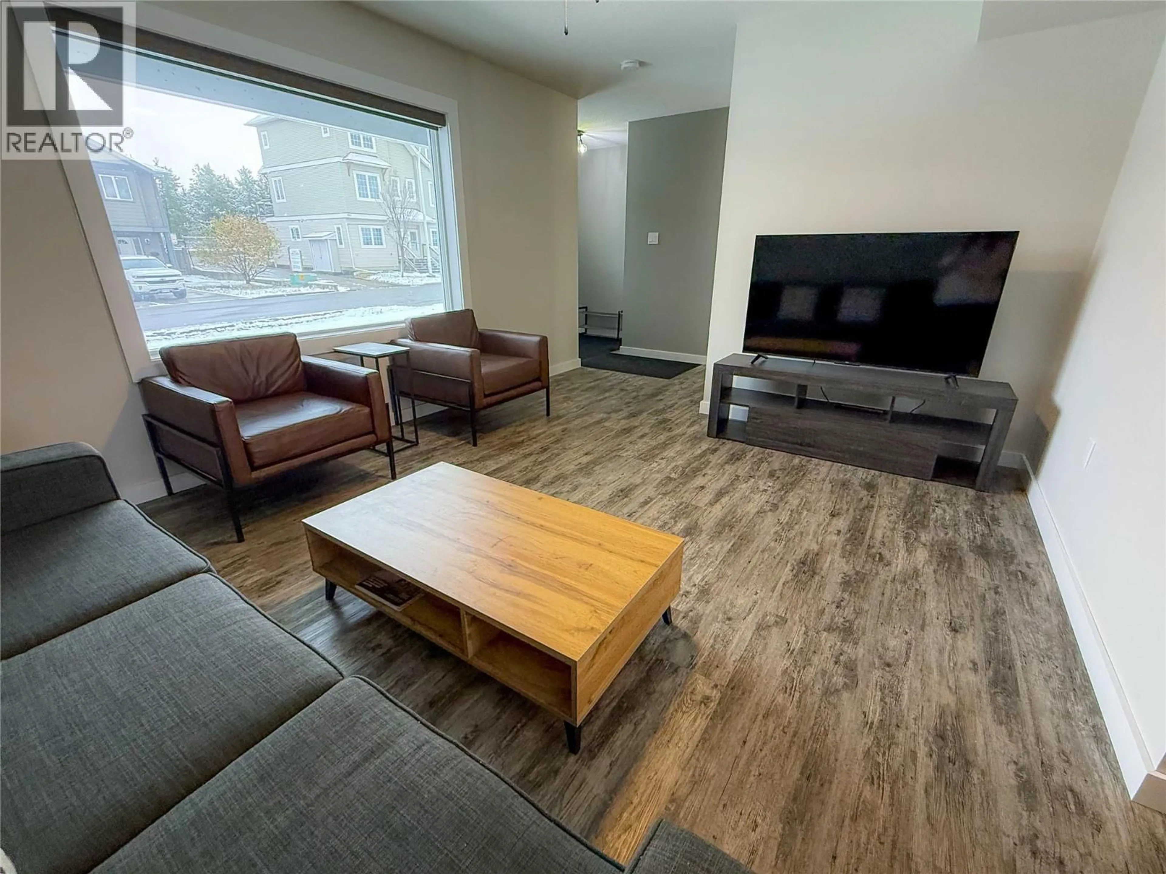 Living room with furniture, wood/laminate floor for LORAN DRIVE, Dawson Creek British Columbia V1G1B7