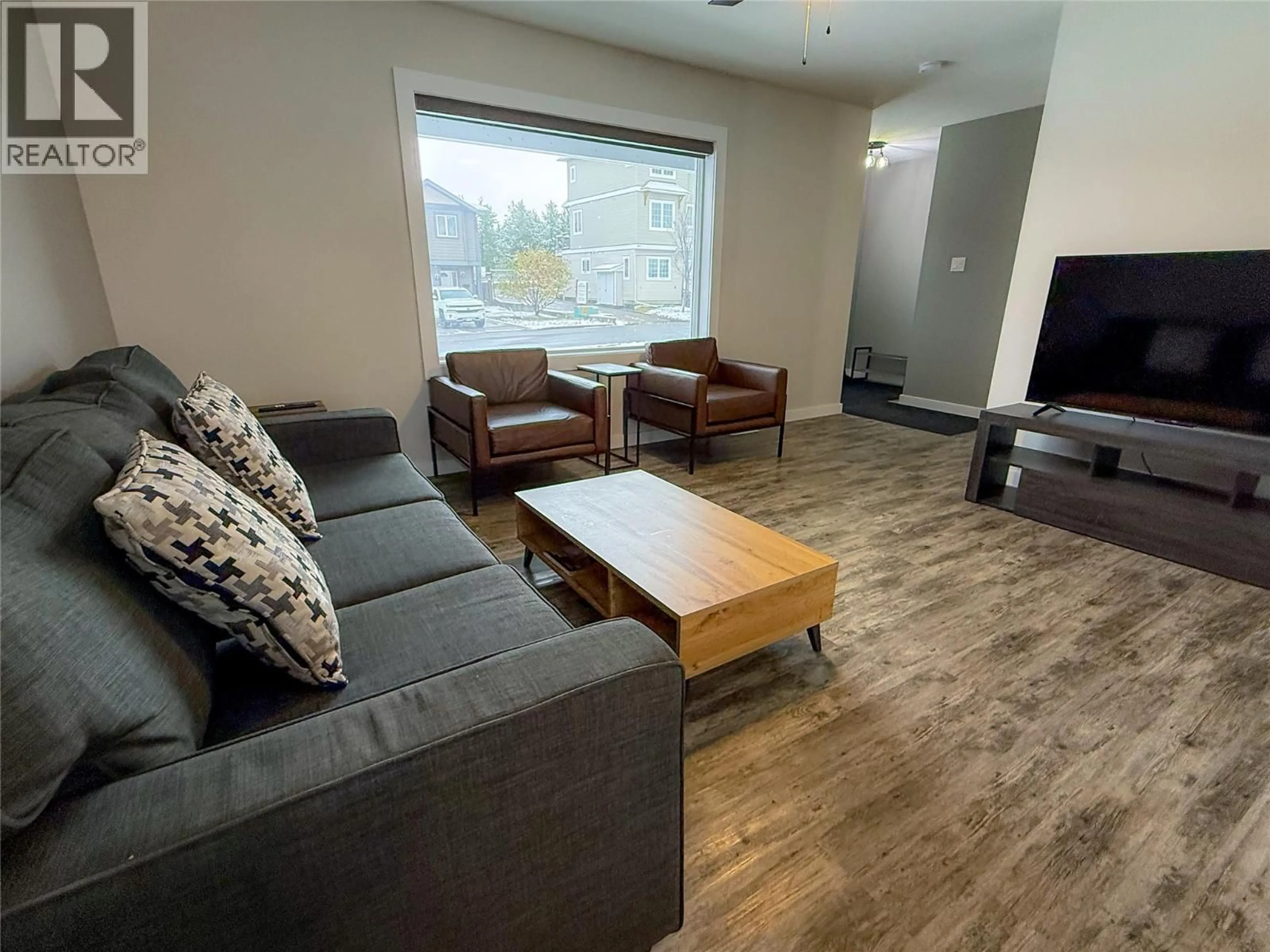 Living room with furniture, wood/laminate floor for LORAN DRIVE, Dawson Creek British Columbia V1G1B7